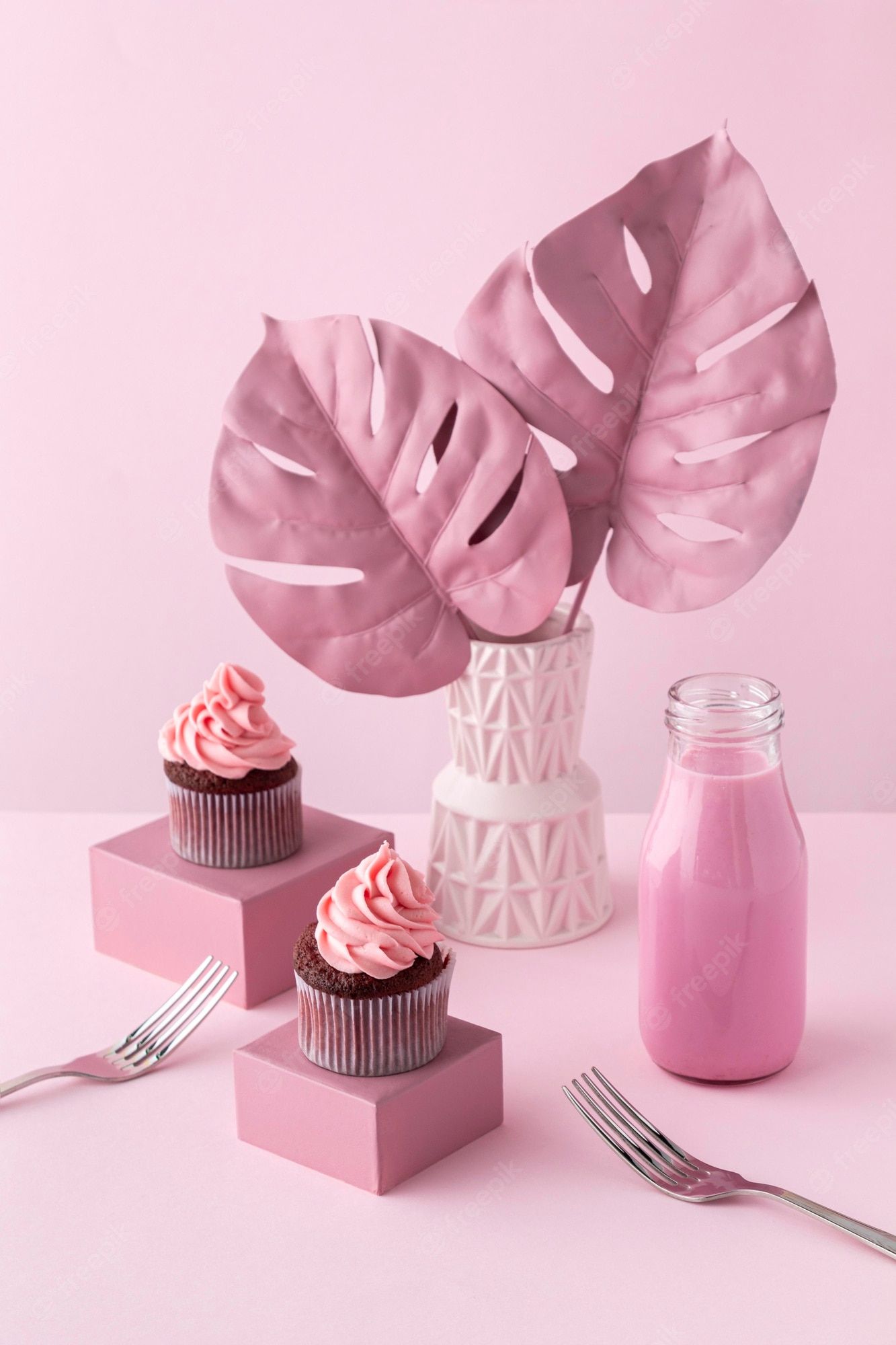 Free Photo. Monstera plants and pink cupcakes