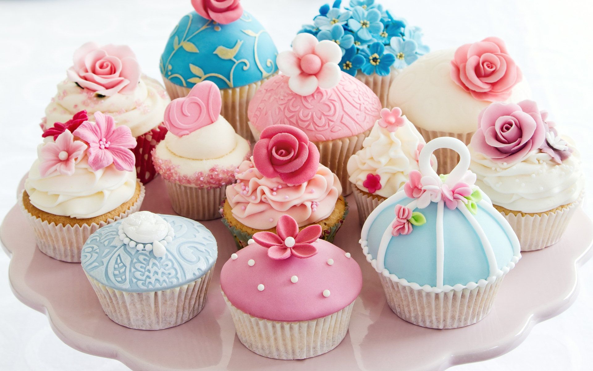 A pink plate with many cupcakes on it - Cupcakes