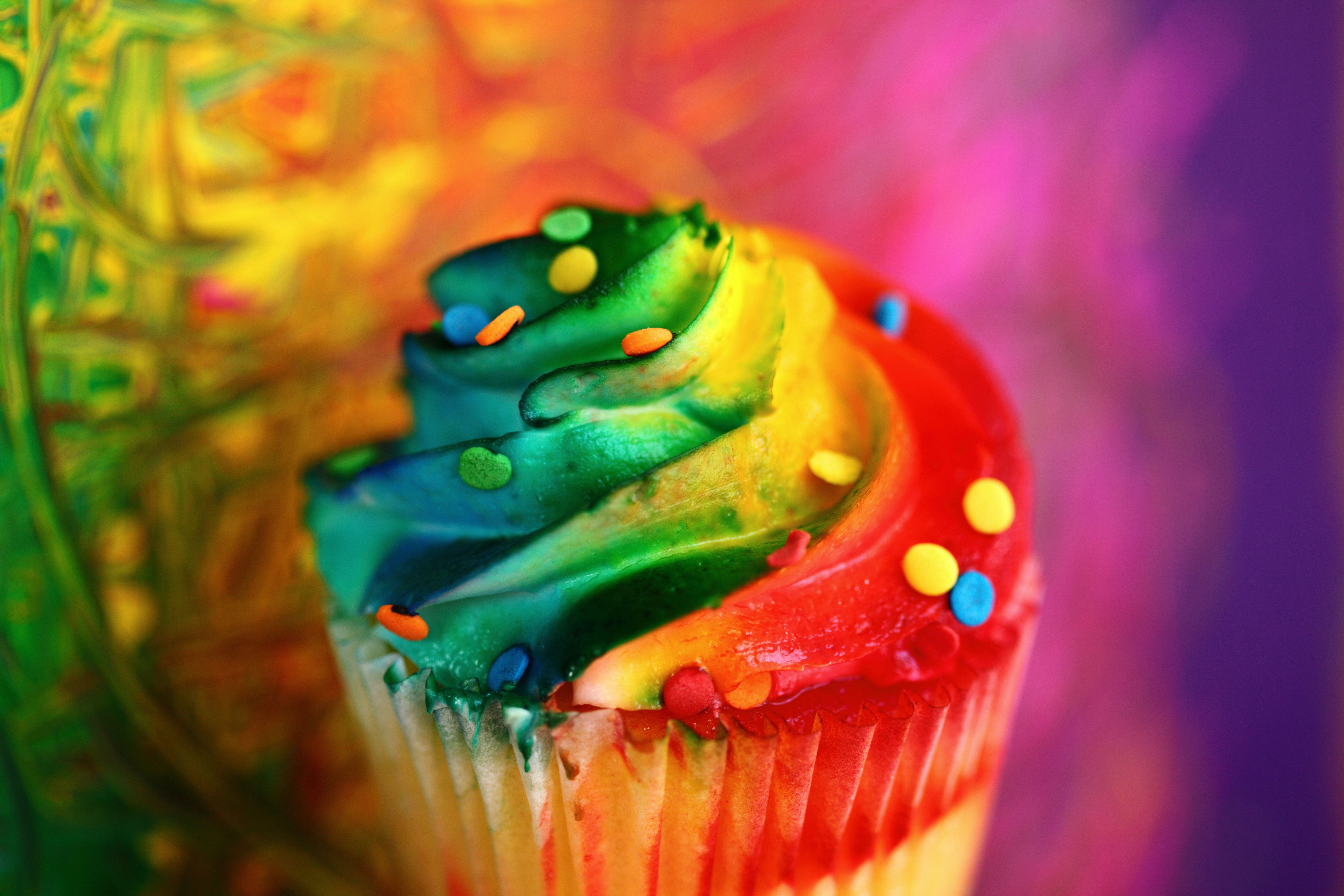 A cupcake with sprinkles and frosting on it - Cupcakes, colorful
