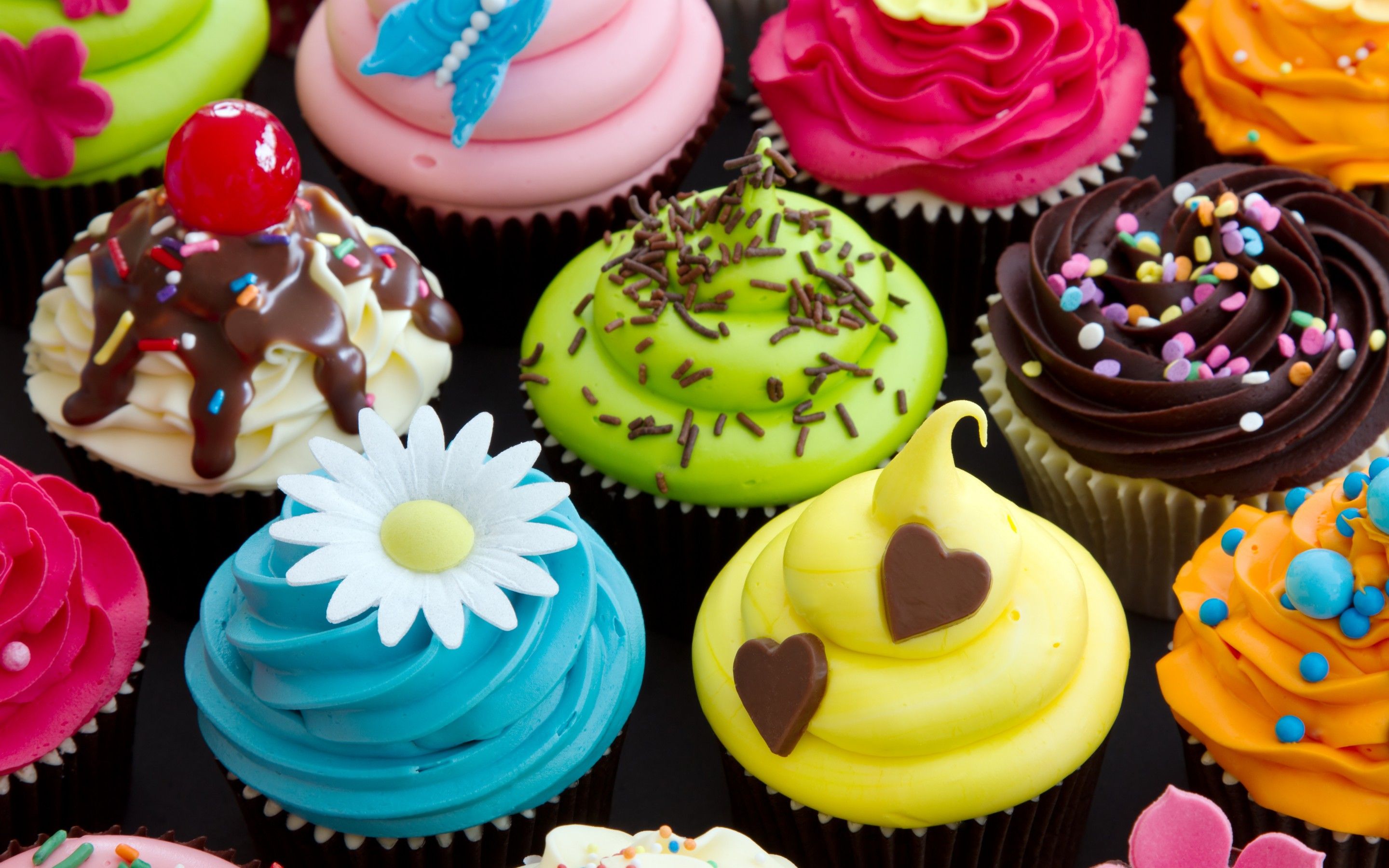 A close up of many different colored cupcakes - Cupcakes