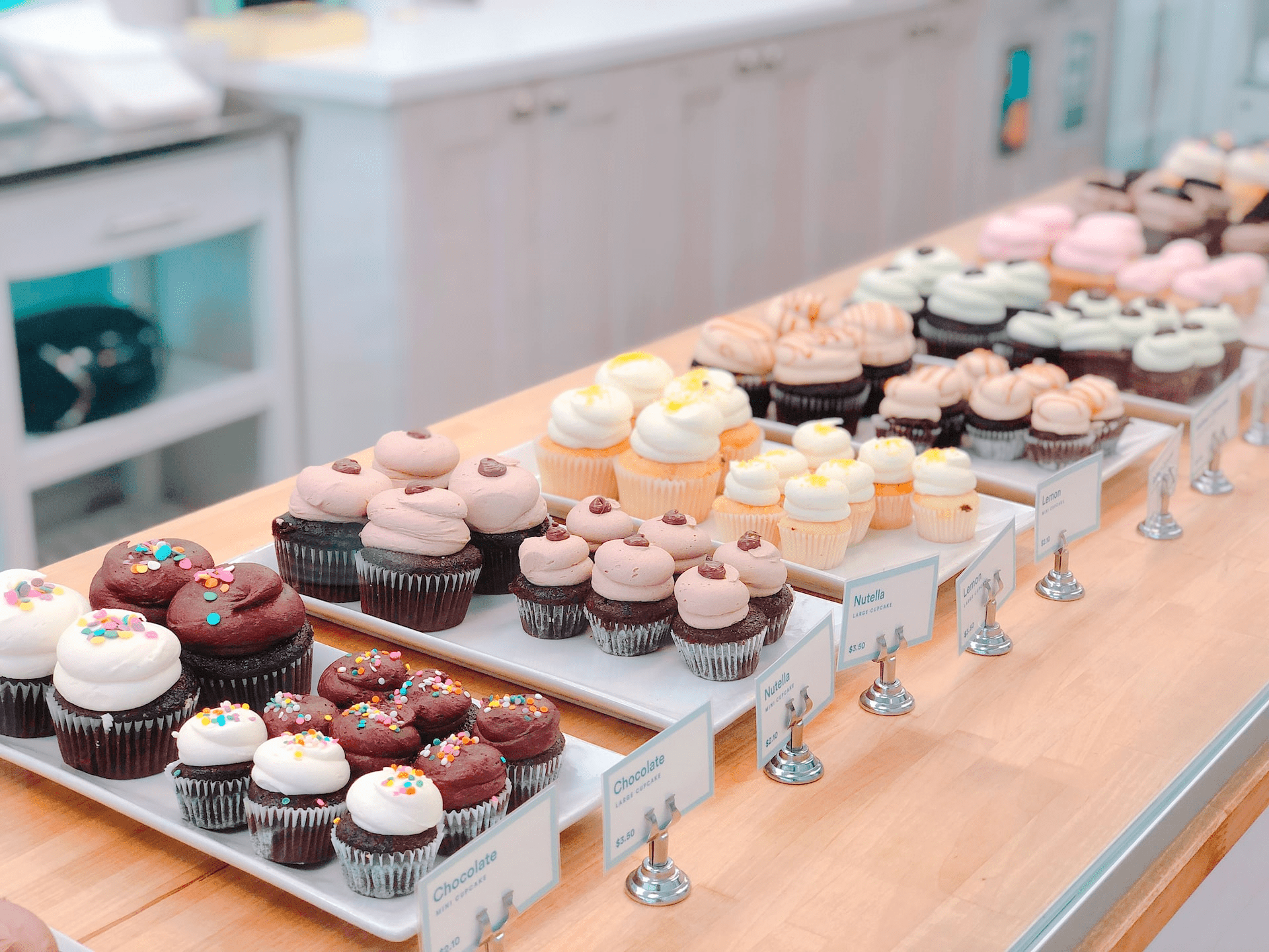 A table with many cupcakes on it - Cupcakes