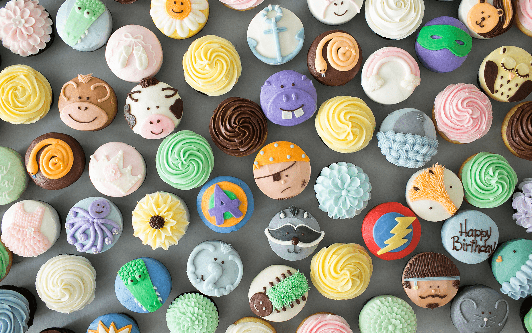 A variety of cupcakes with different icing designs - Cupcakes