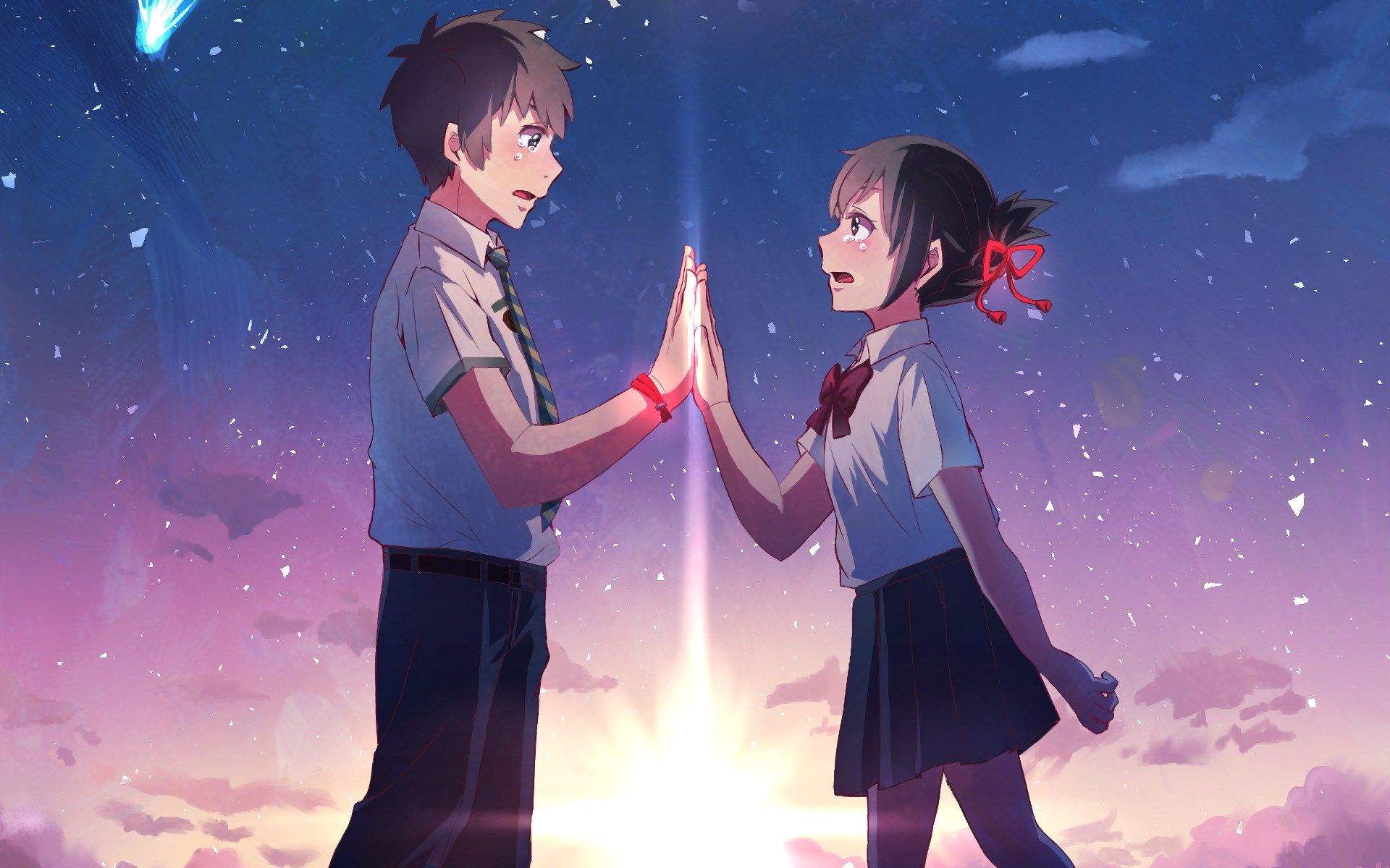 A scene from the anime film 'Your Name' where two teenagers high five in the sky. - 1920x1200