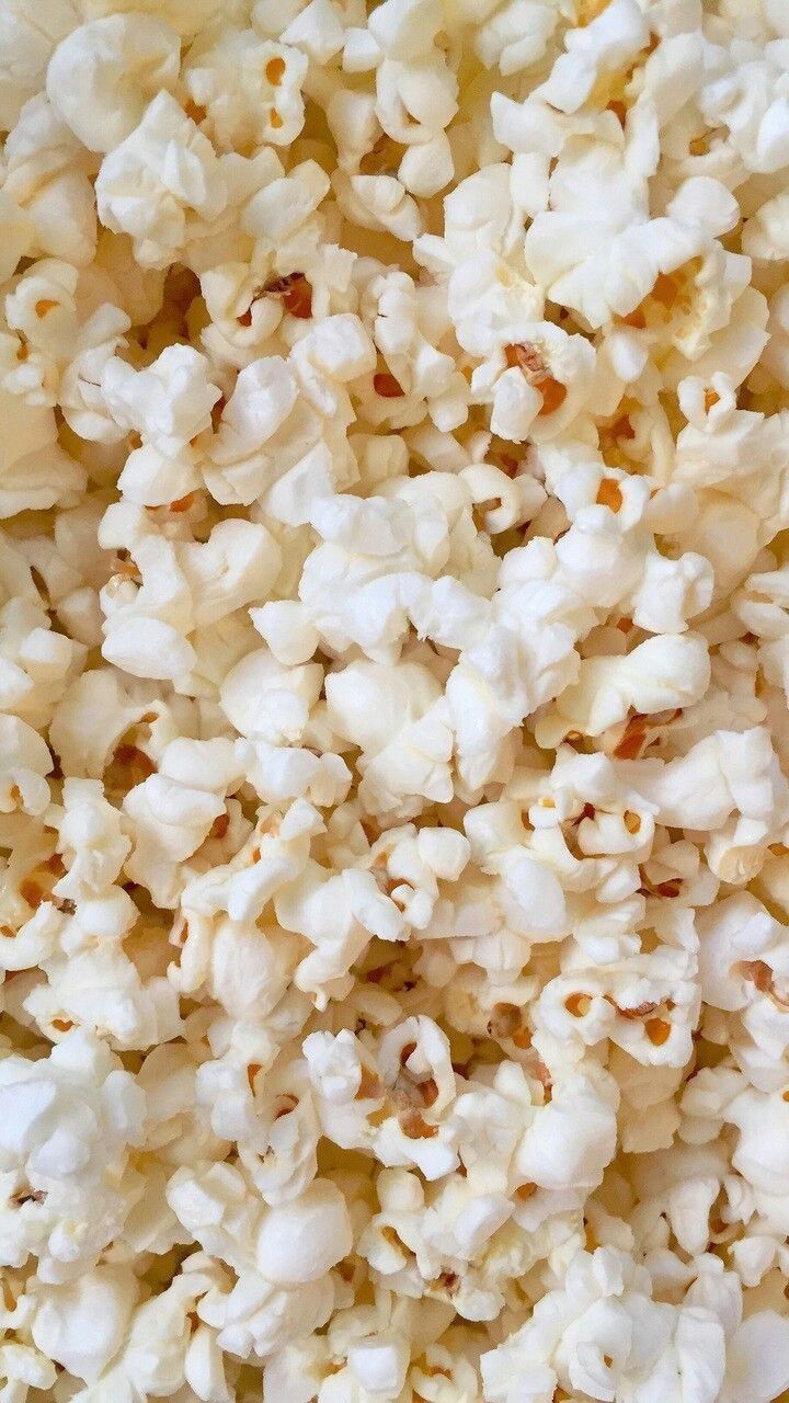 A close up of popcorn on a white background - Popcorn