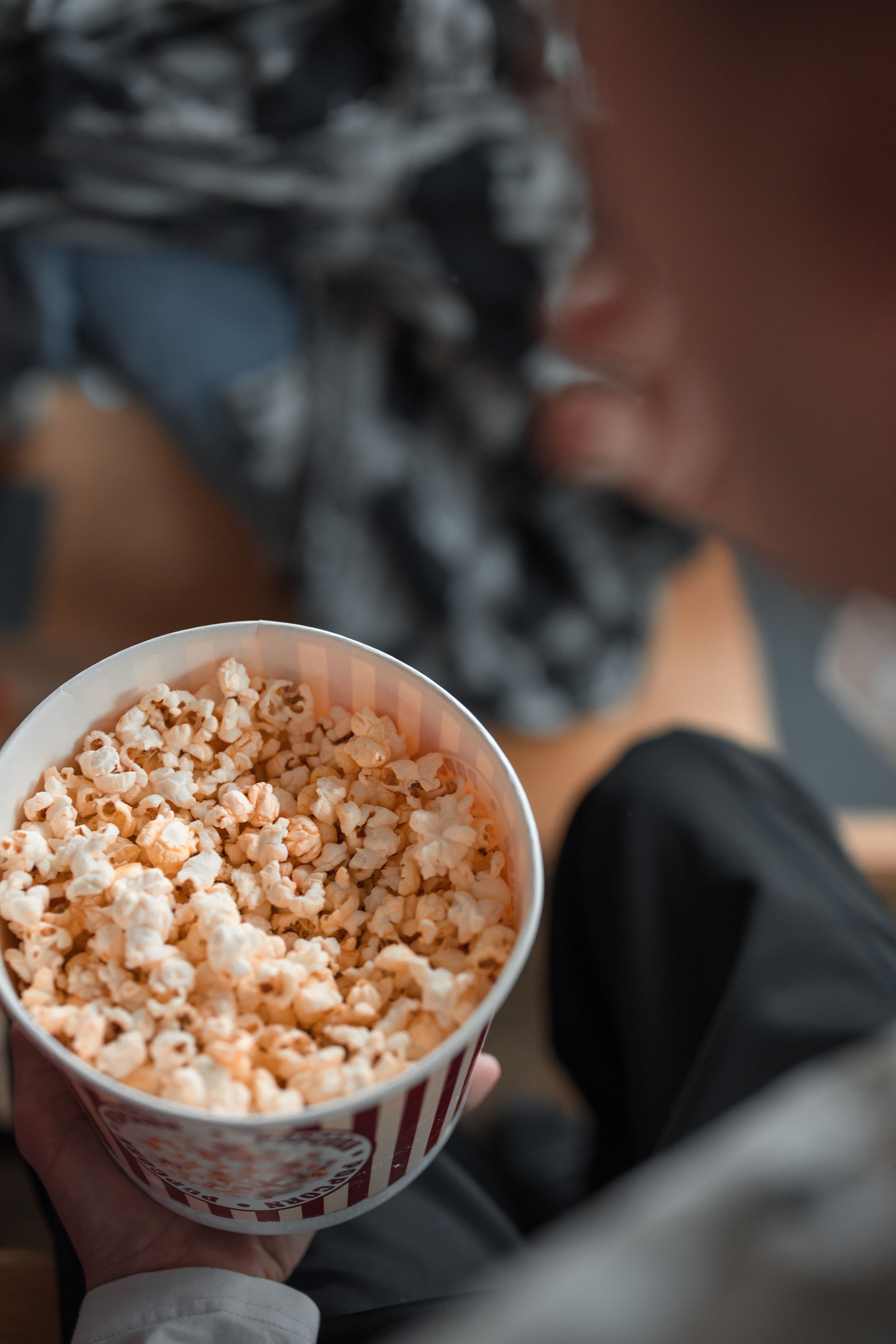 Person Holding a Bucket of Popcorn · Free