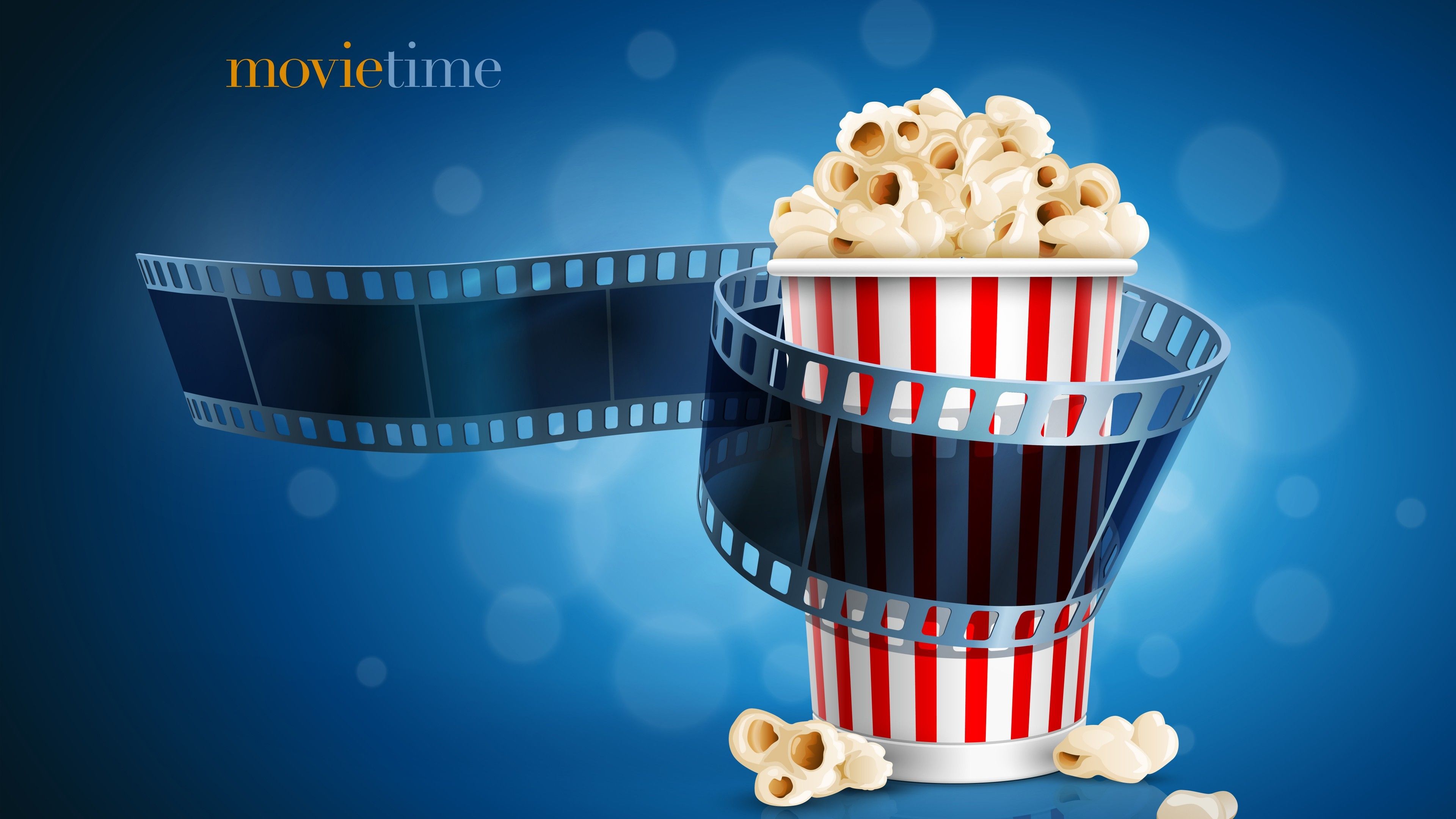 A cup of popcorn with movie film - Popcorn