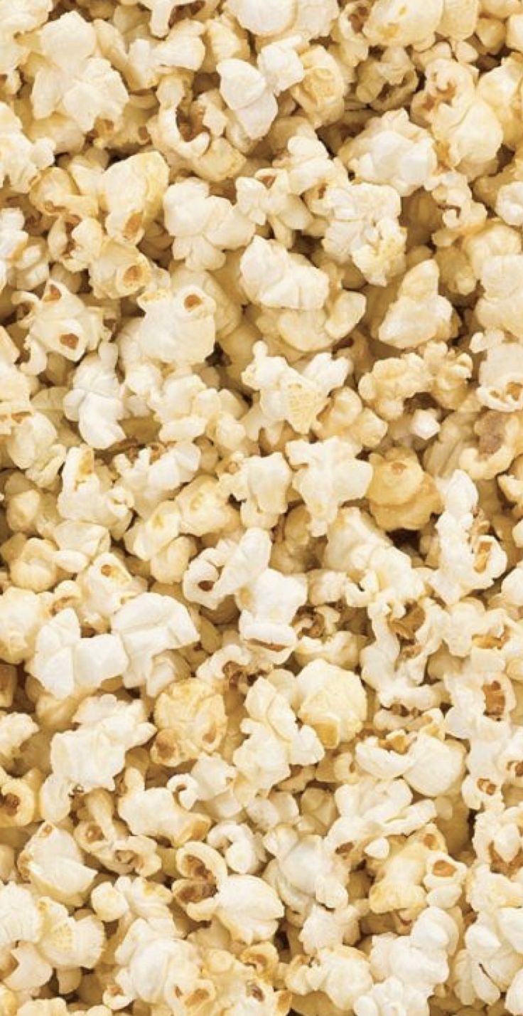 A close up of popcorn, a popular snack for watching movies. - Popcorn