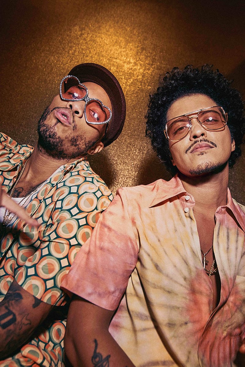 Bruno Mars and Anderson .Paak wearing sunglasses and leaning against a wall - Bruno Mars