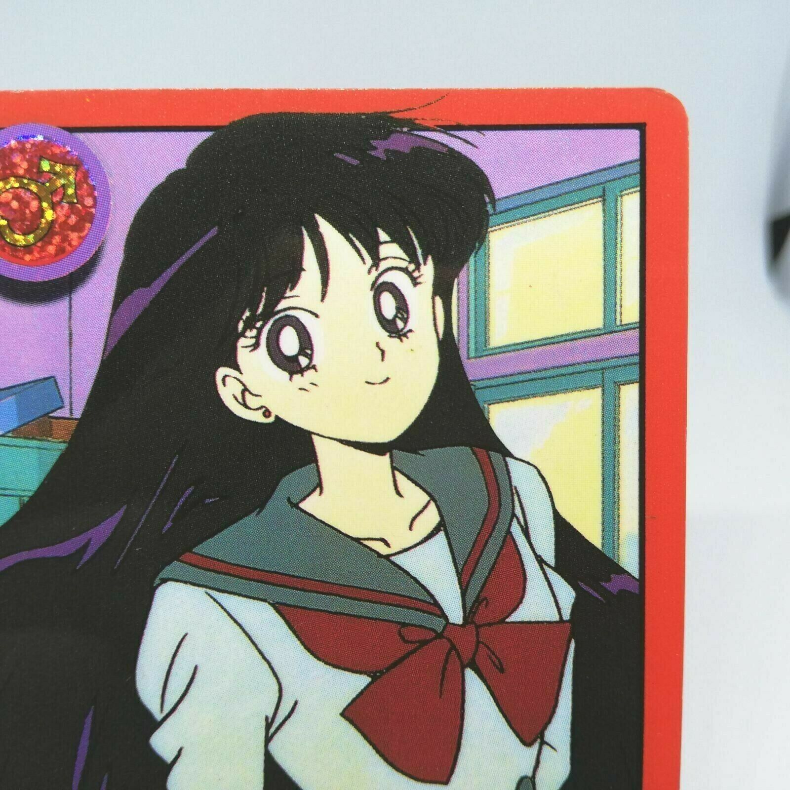 A cartoon character with long hair and red bow - Sailor Mars