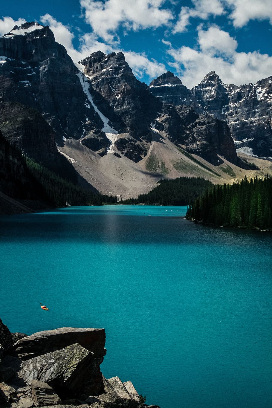 Turquoise lake with snow-capped mountains in the background - Lake
