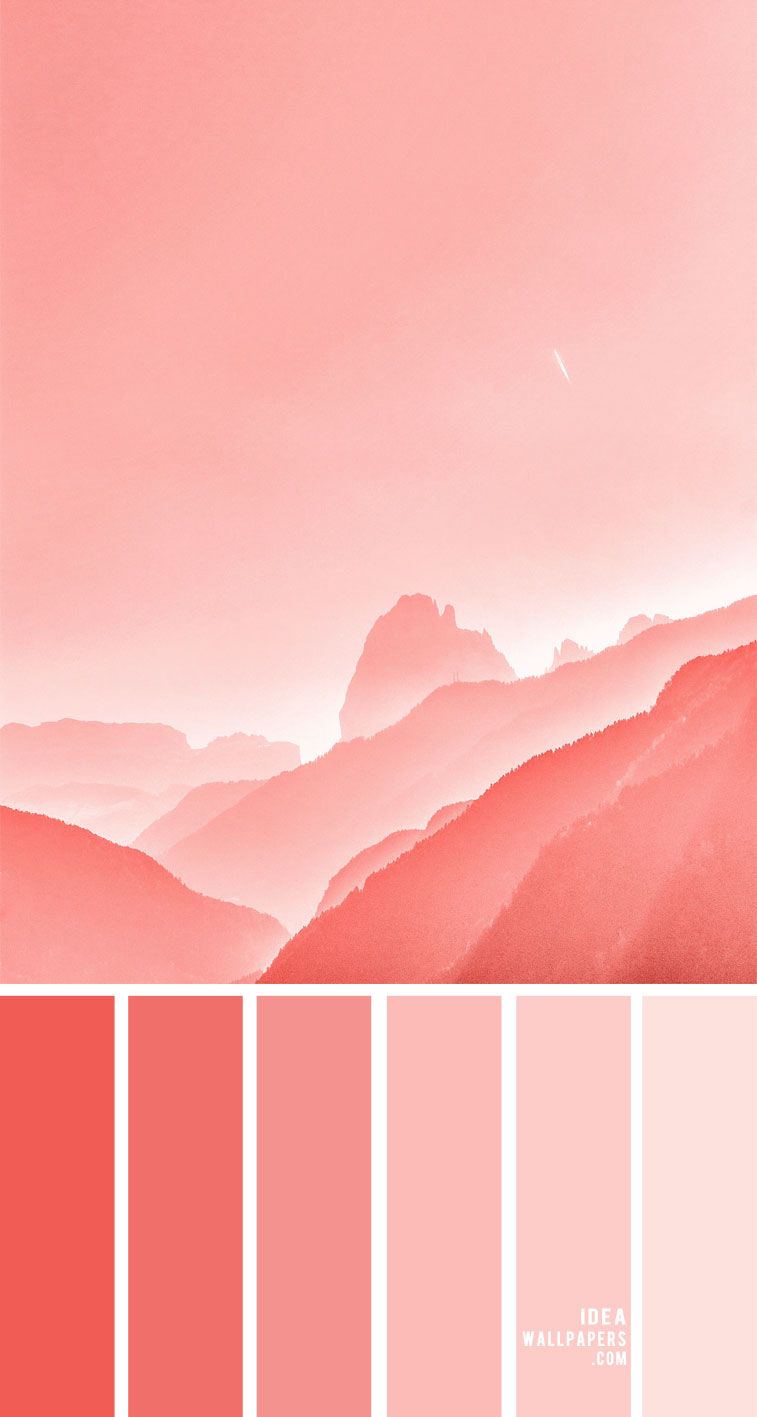 Salmon pink and red mountains with a pale pink sky - Coral