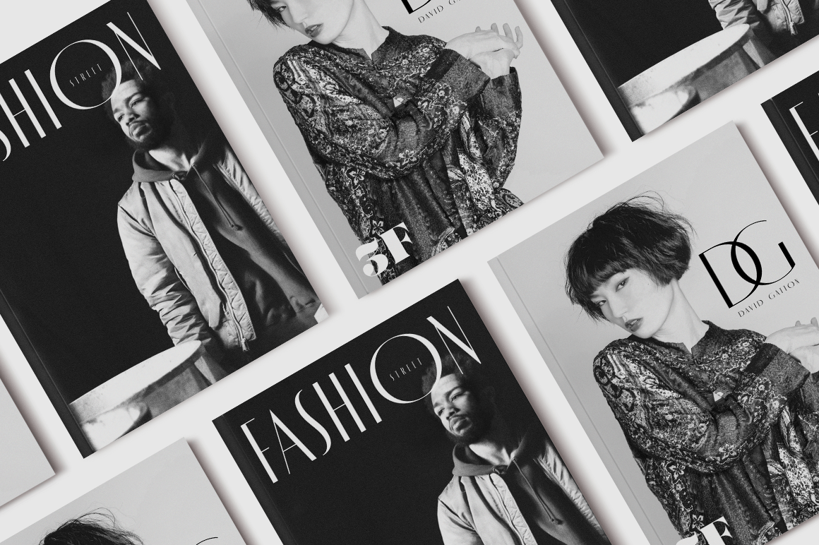 A collection of fashion magazines on a white table. - Fashion