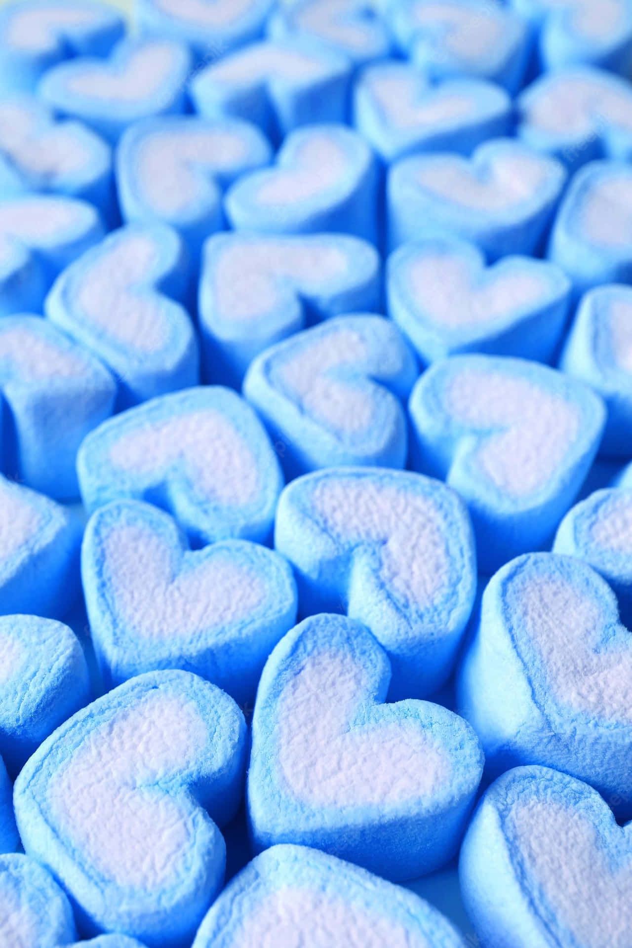 A close up of blue hearts that are made out to look like marshmallows - Marshmallows
