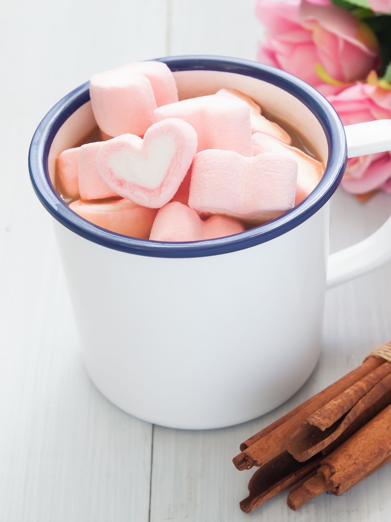 A cup of marshmallows and cinnamon sticks - Marshmallows