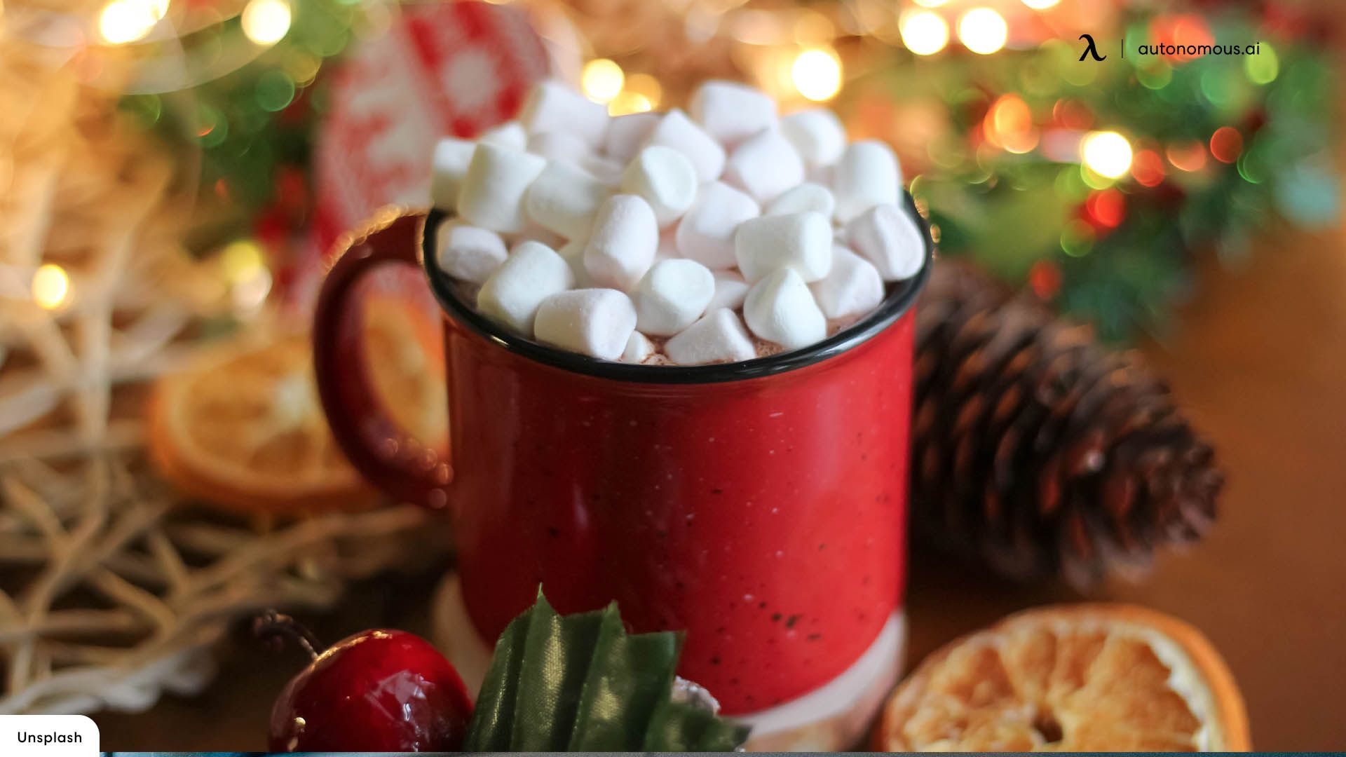 A red mug of hot chocolate with marshmallows surrounded by Christmas decorations - Marshmallows, candy cane