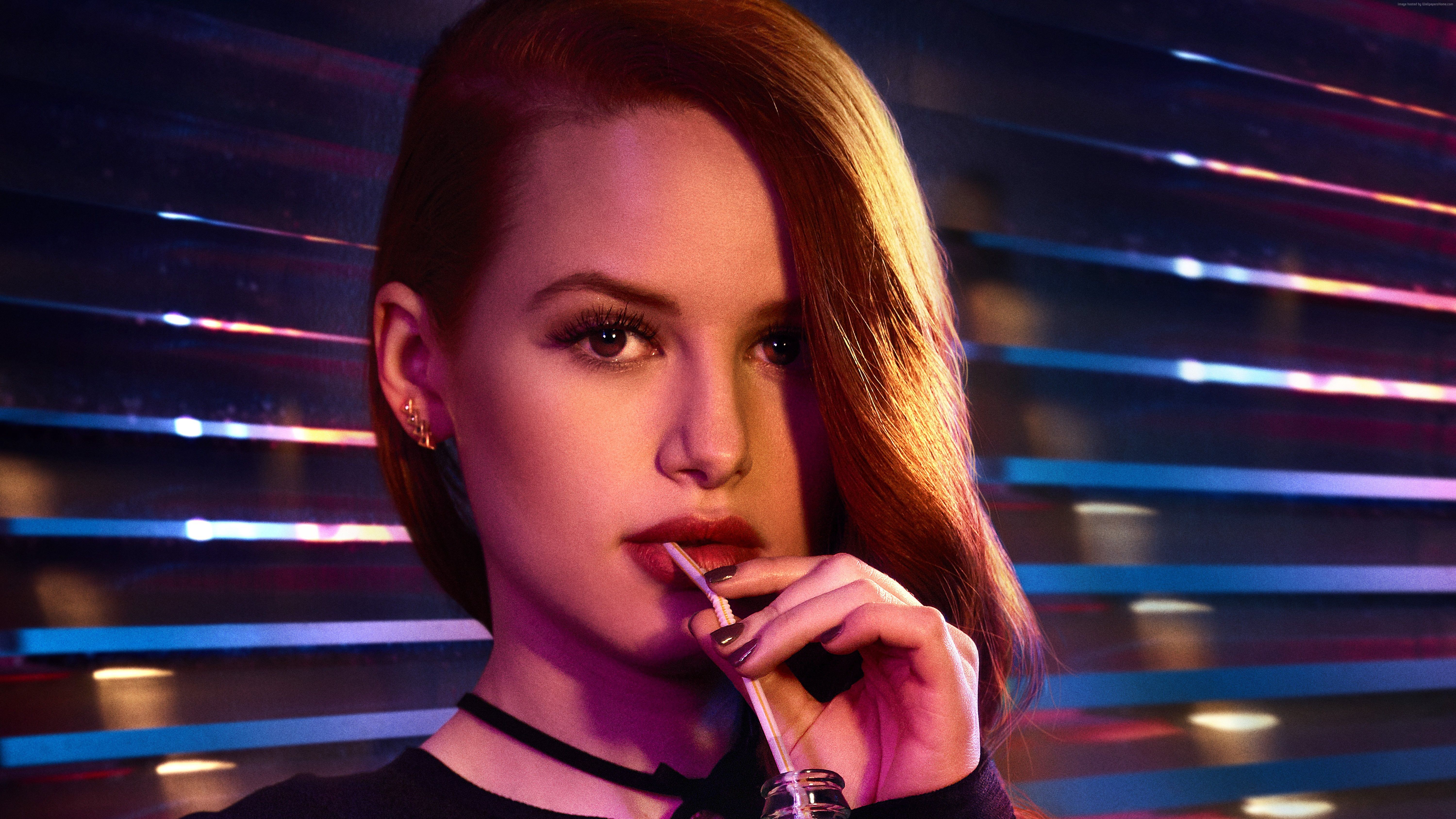 Close up of a beautiful girl with red hair and a drink in her hand - Riverdale