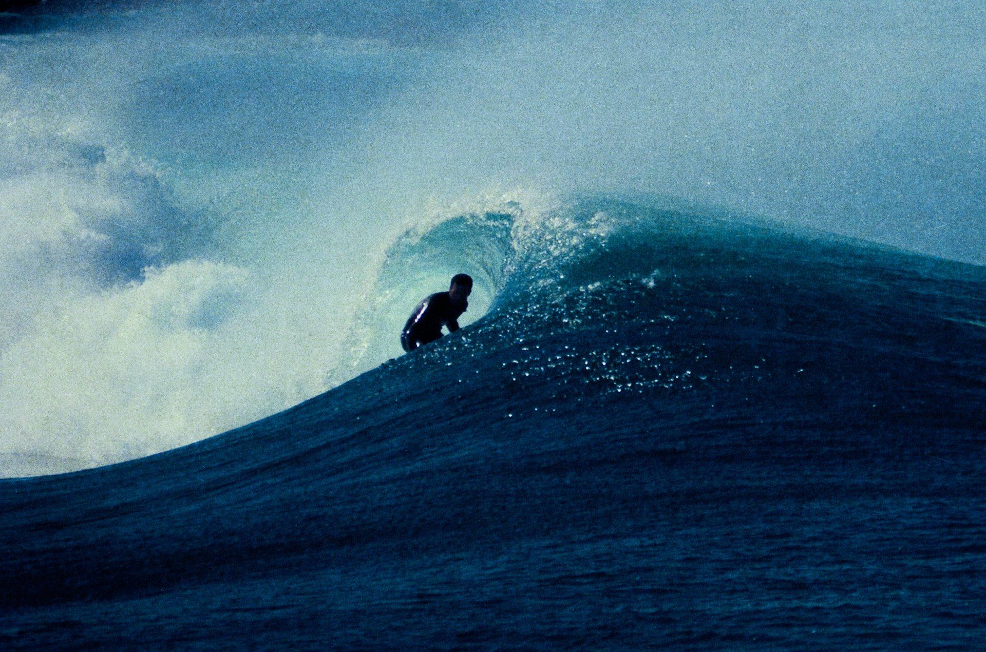 A surfer riding a wave - Surf