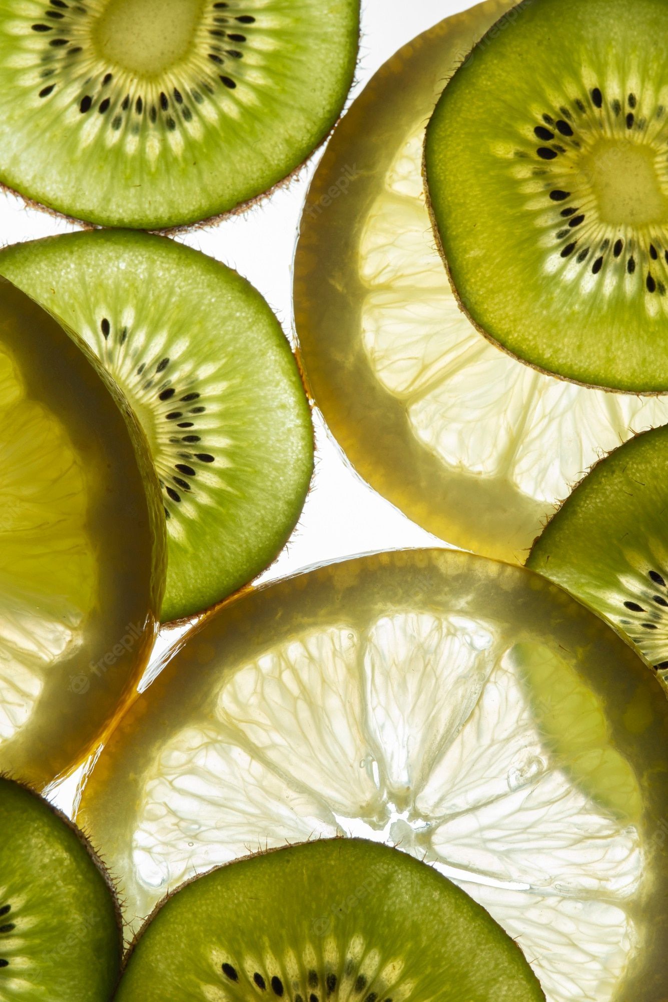 A close up of slices of kiwi and lemon - Kiwi