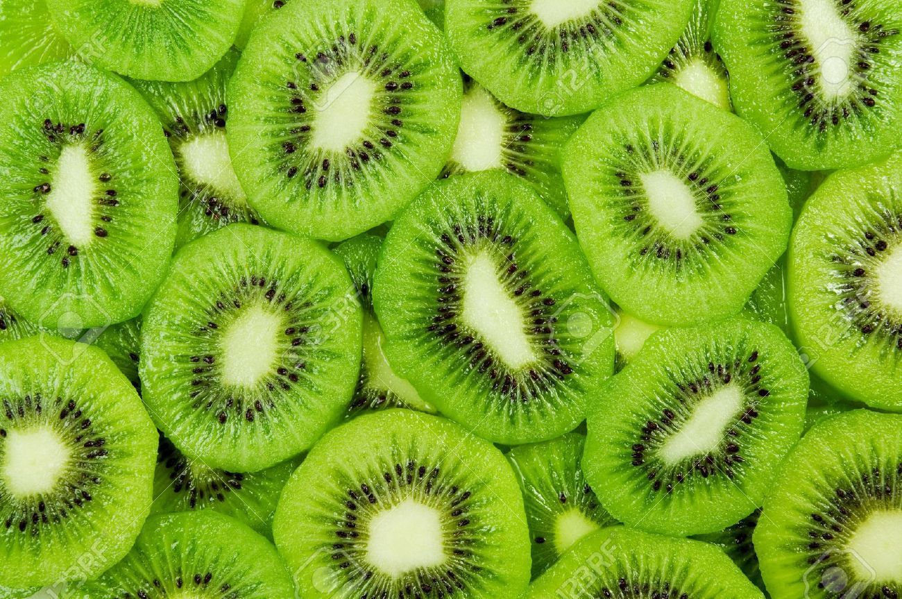 Background of slices of kiwi fruit. - Kiwi