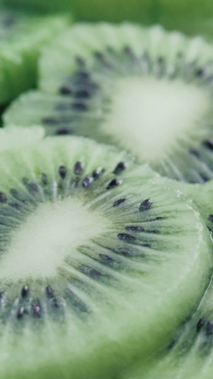 A close up of a sliced kiwi - Kiwi