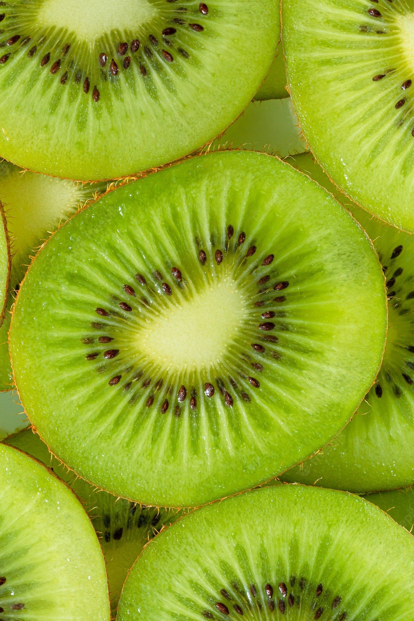 Premium Photo. Kiwi macrokiwi fruit pattern healthy food background overhead