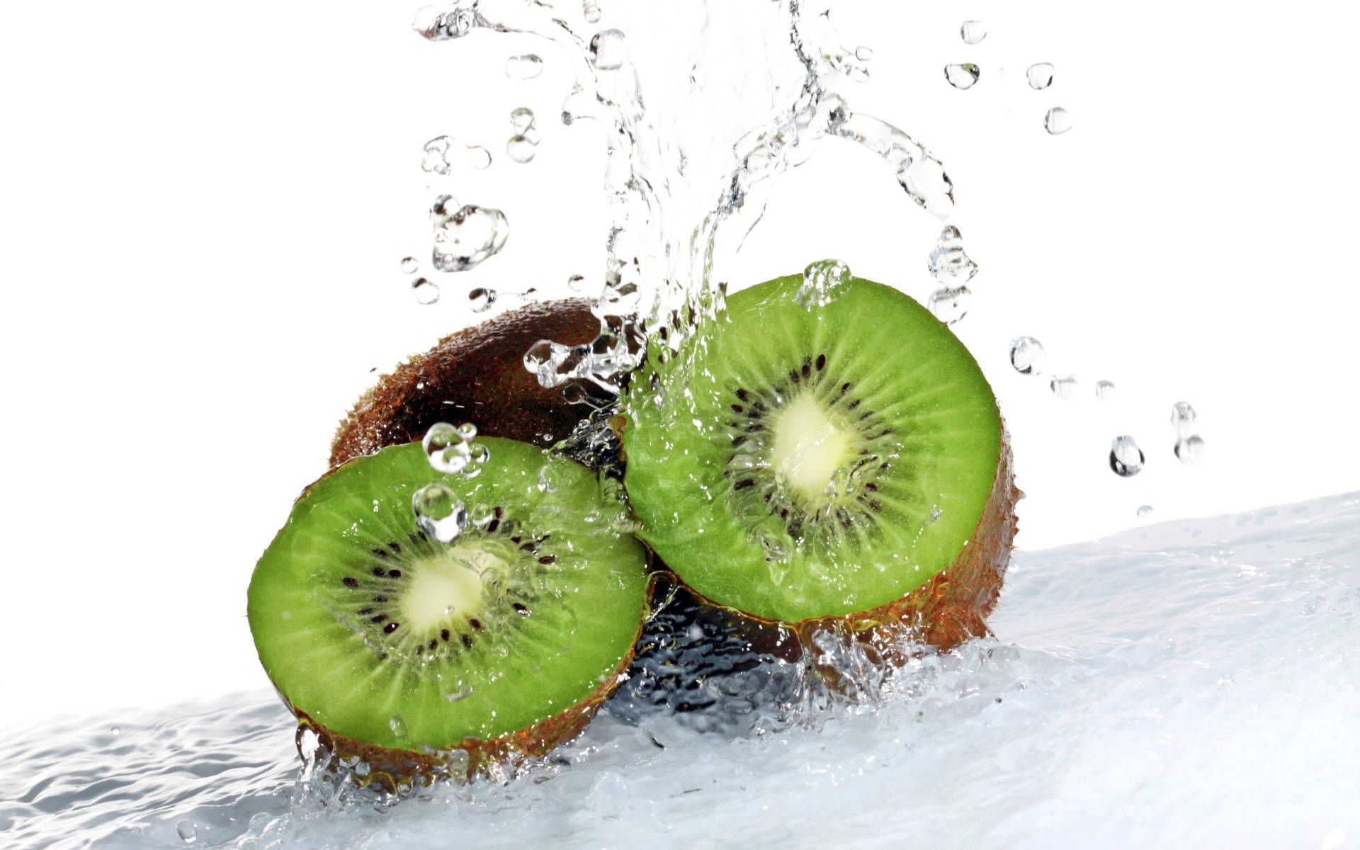 Kiwi slices in water with a splash - Kiwi