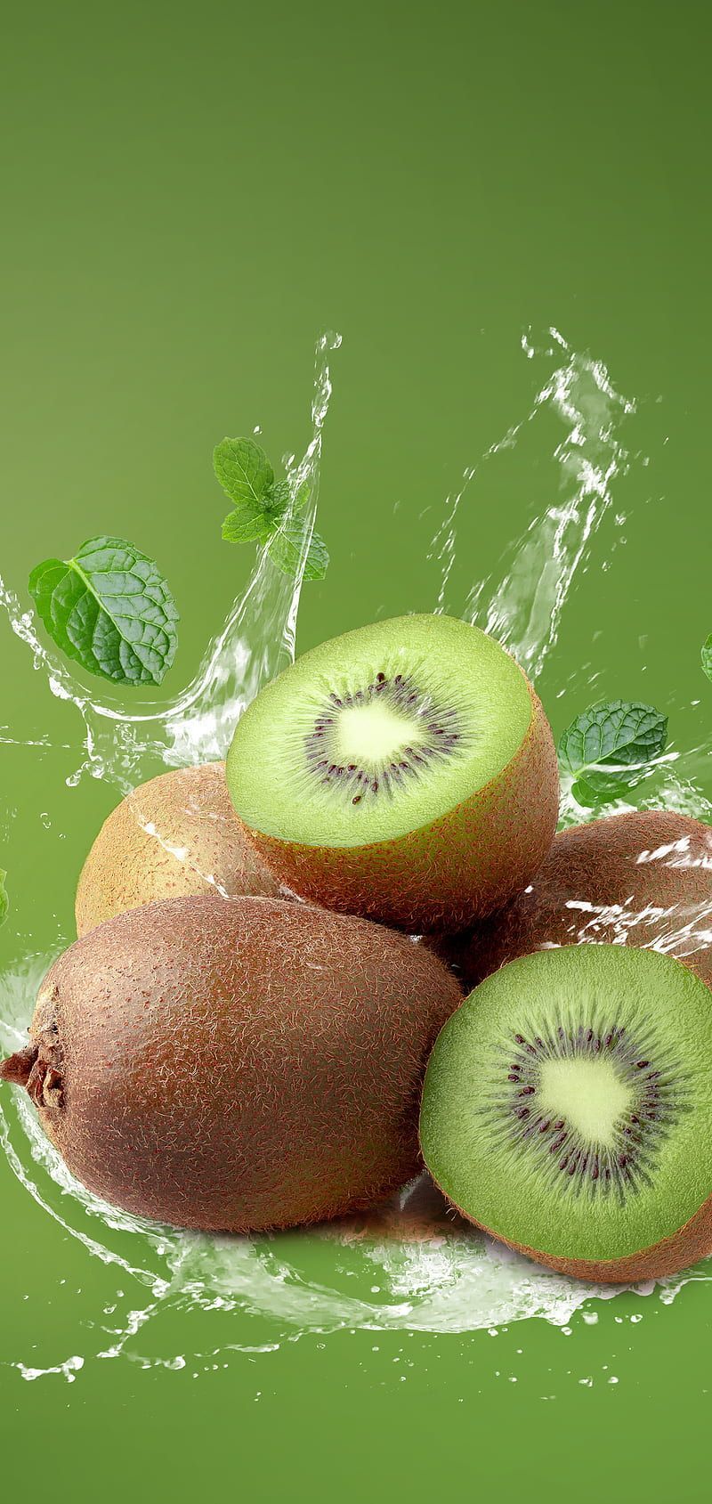 A group of kiwi fruit with a splash of water on a green background - Kiwi