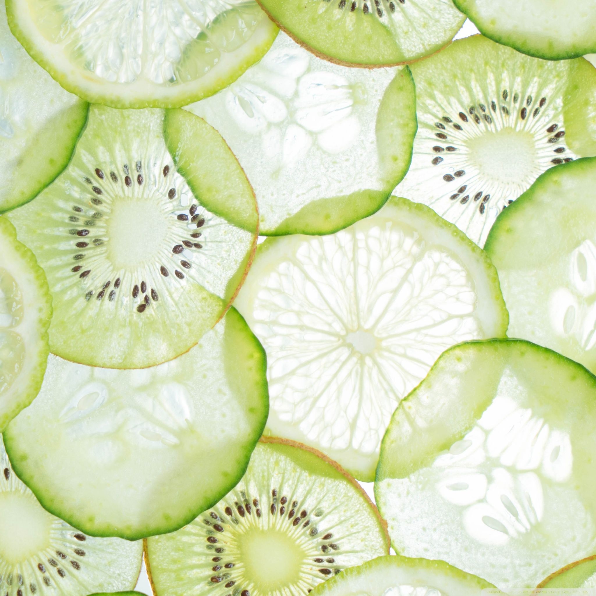 A close up of slices cut from kiwi fruit - Kiwi