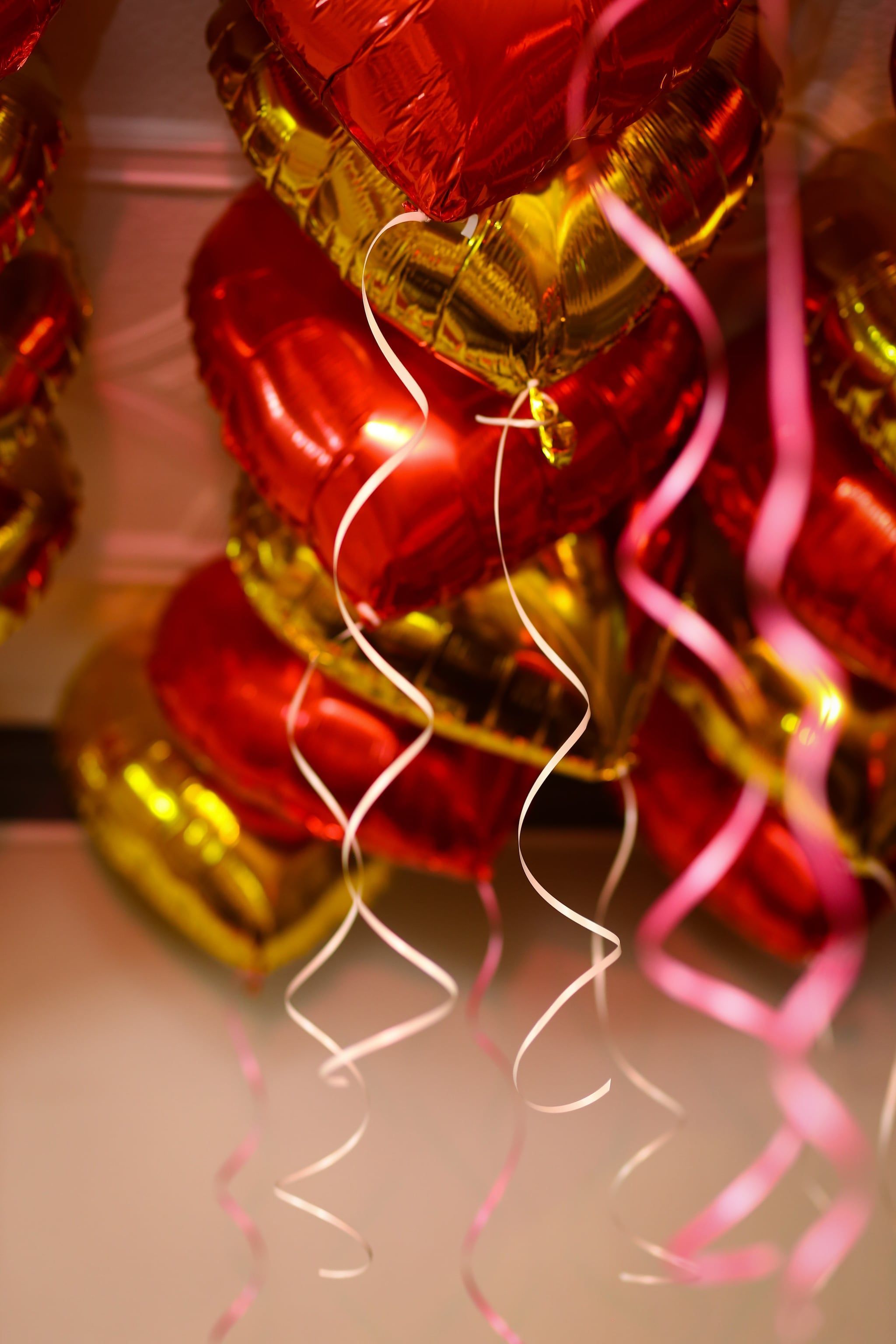 A bunch of balloons hanging from the ceiling - Balloons