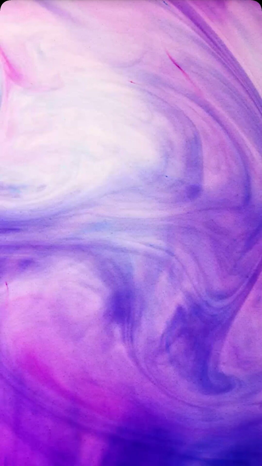A purple and pink swirl pattern on the screen - Watercolor