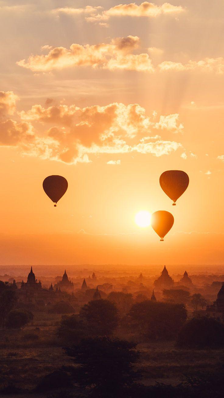 A group of hot air balloons flying over the sunset - Hot air balloons, balloons