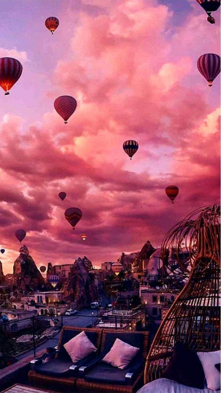 A room with beds and balloons in the sky - Hot air balloons