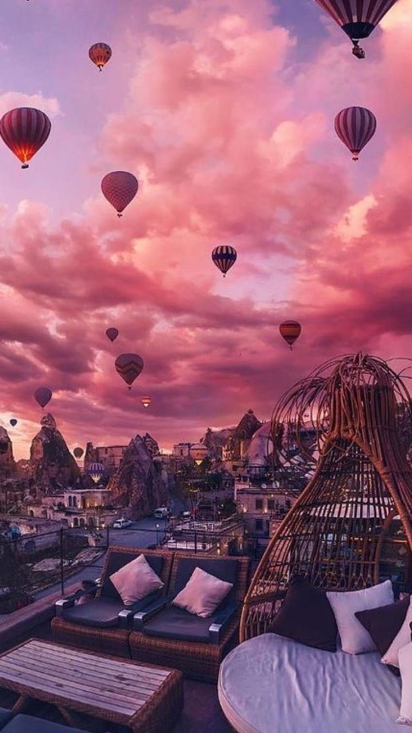 A view of hot air balloons flying over the city - Hot air balloons