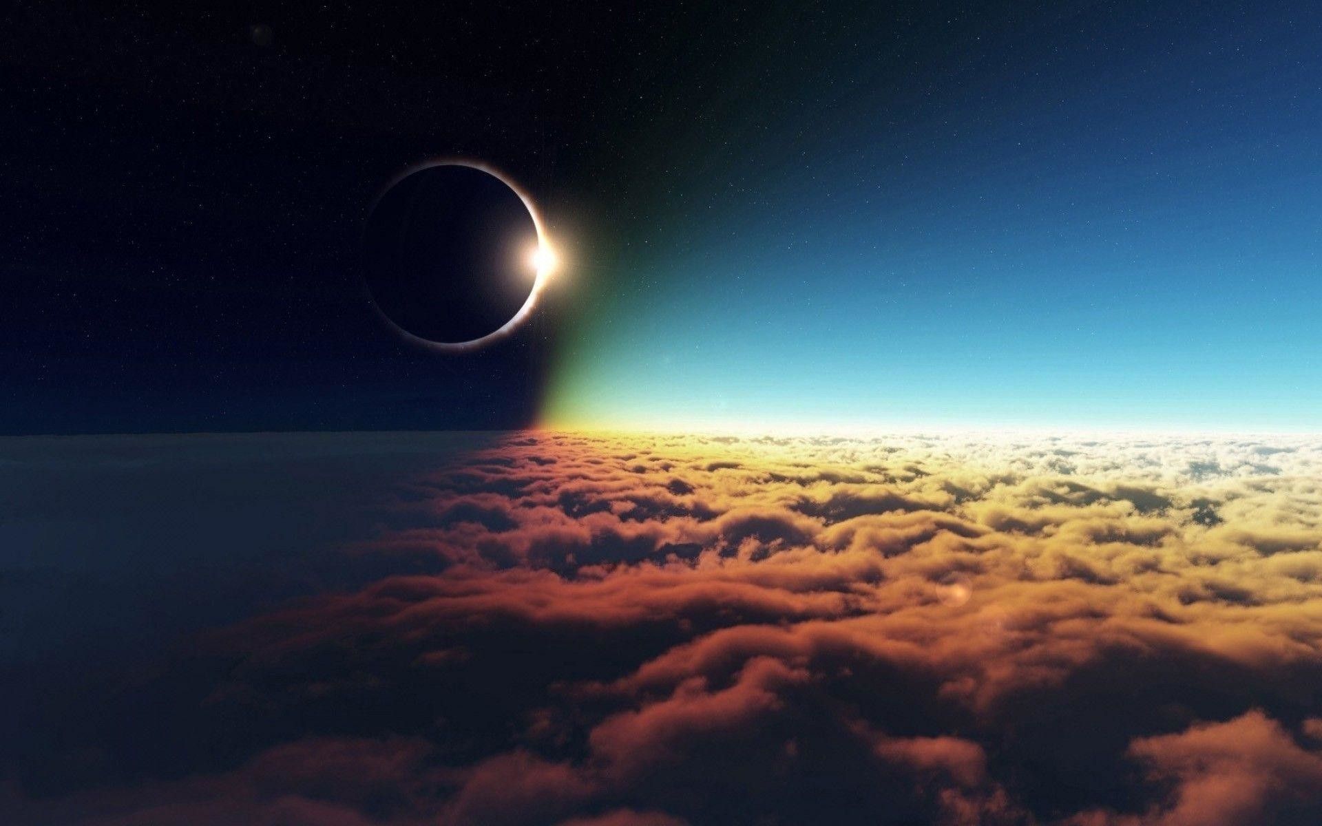 The sun and moon in the sky above the clouds - Eclipse