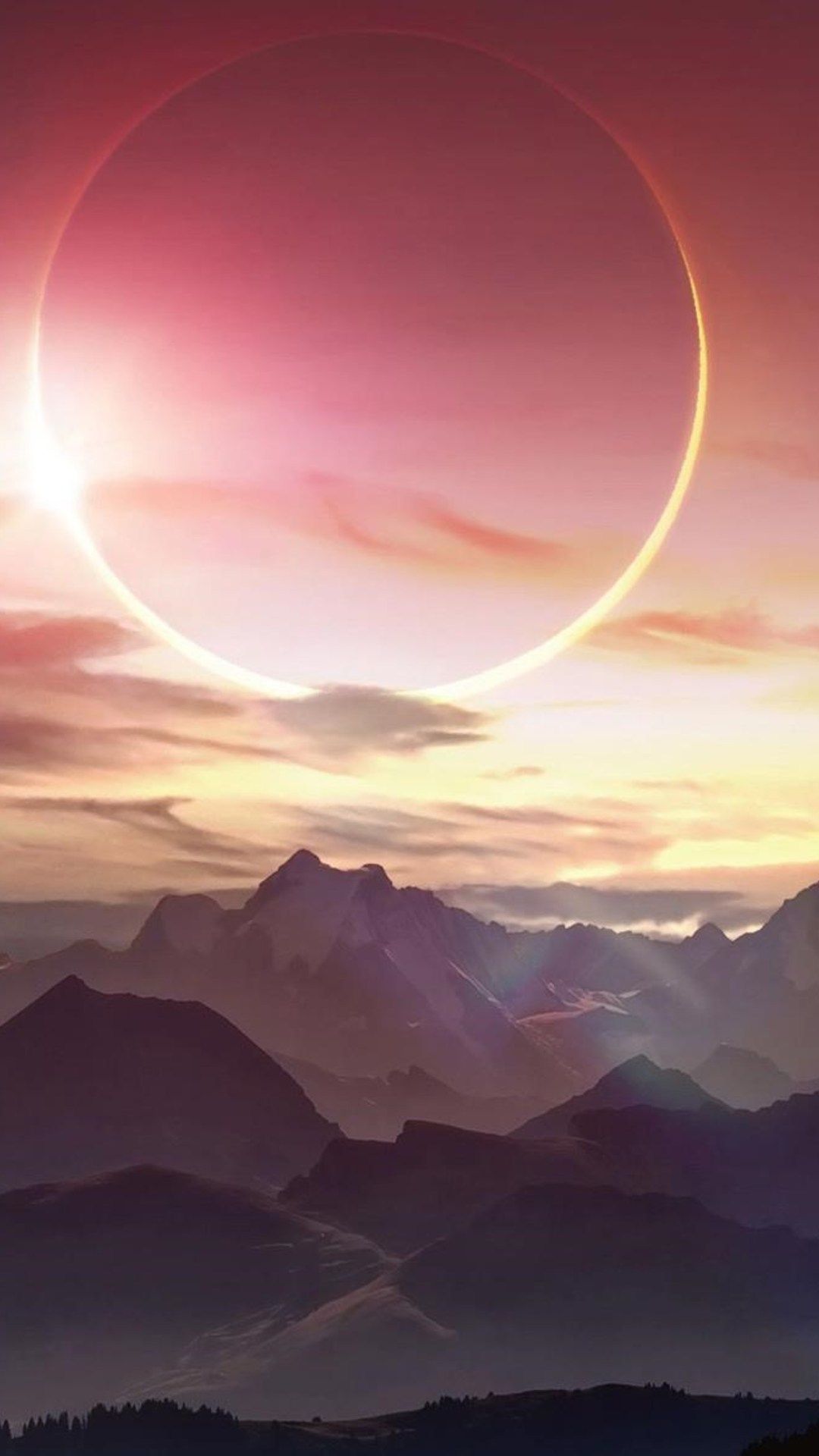 A beautiful sunset over a mountain range with a solar eclipse. - Eclipse