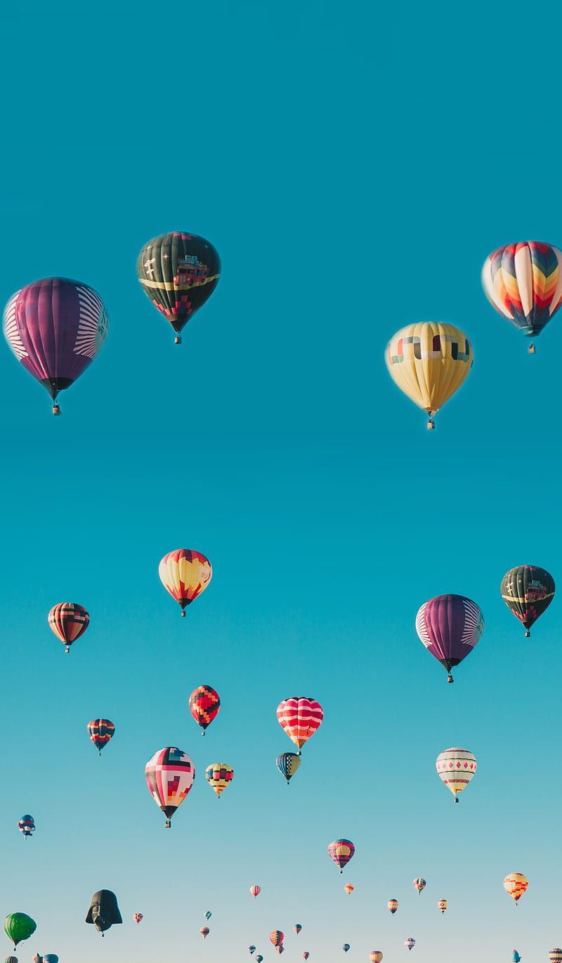 A lot of hot air balloons flying in the blue sky - Hot air balloons