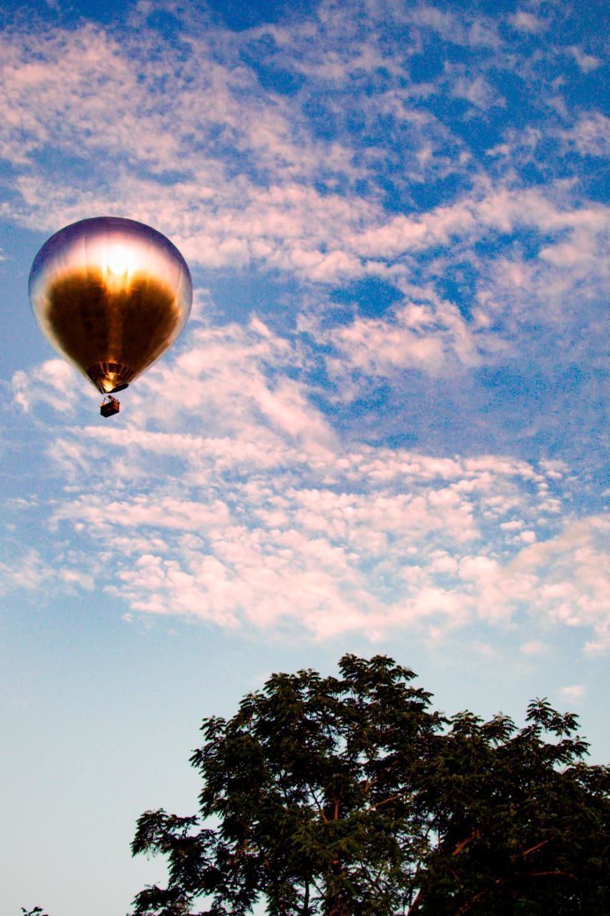 Artist flies giant mirrored hot air balloon