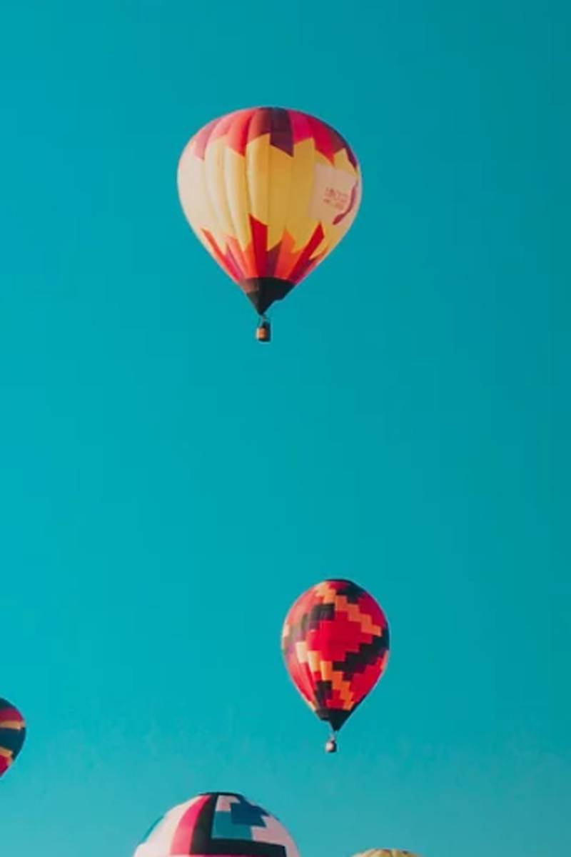 A group of colorful hot air balloons flying in the sky - Hot air balloons