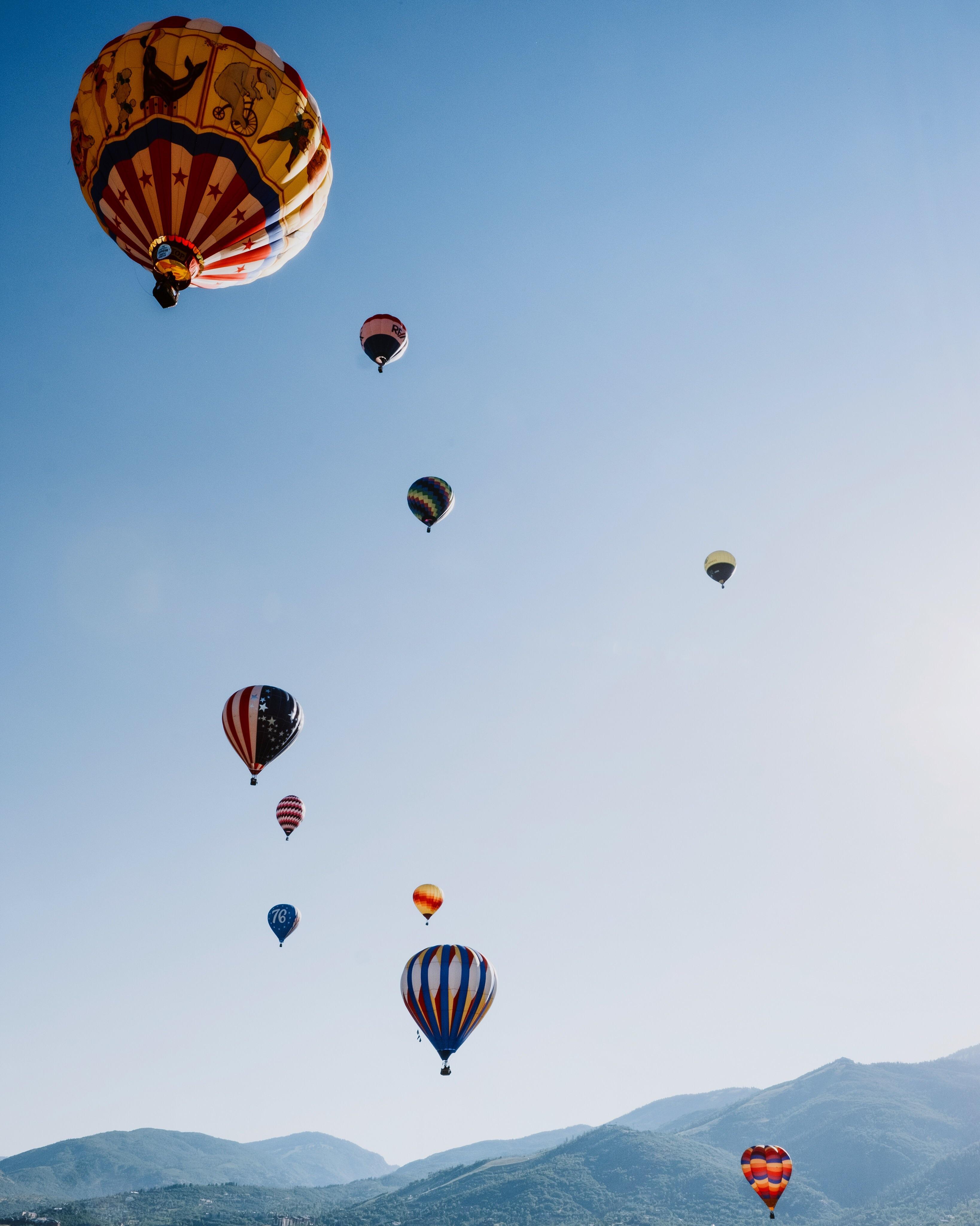 A group of hot air balloons floating in the sky - Hot air balloons