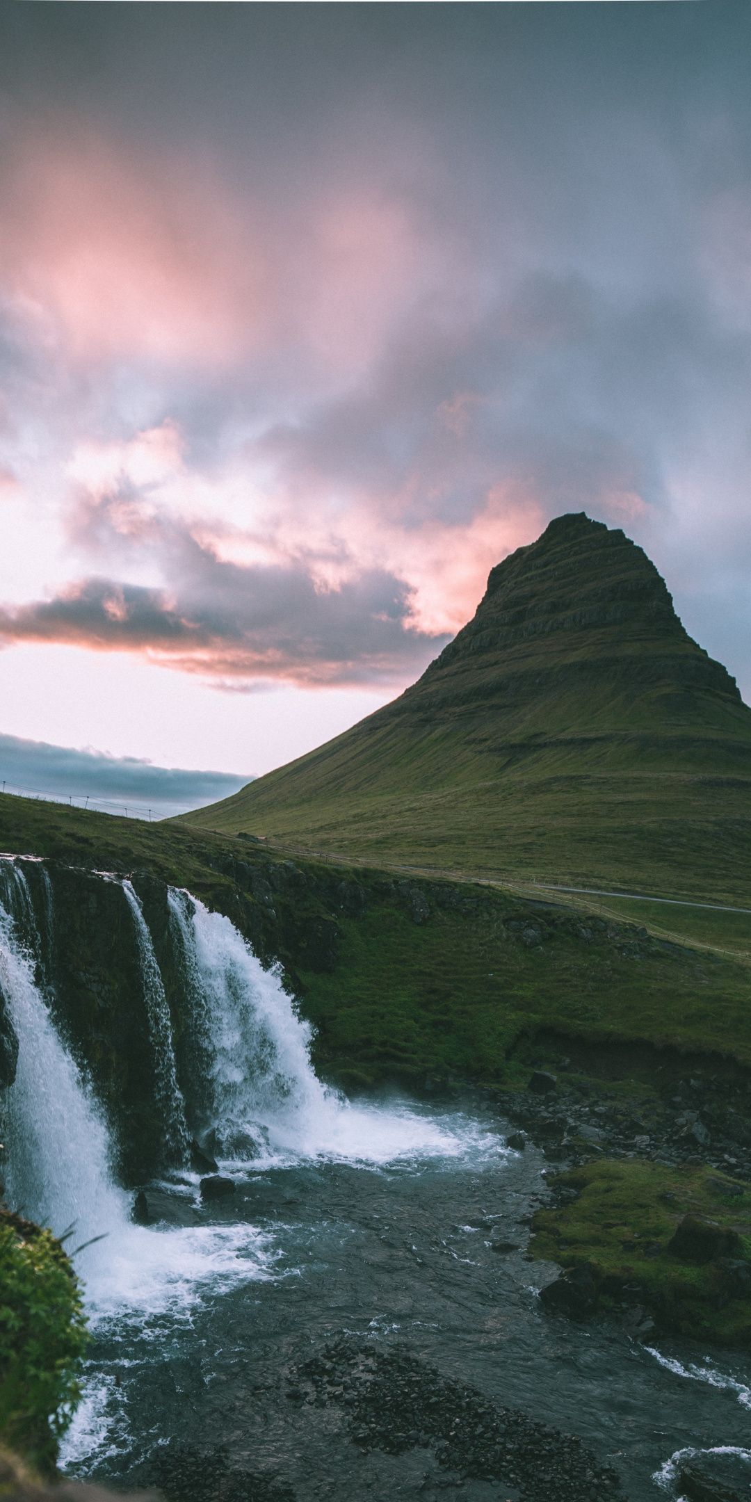 A waterfall in the mountains with clouds - Waterfall