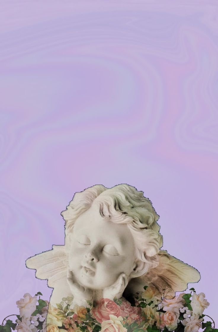 A statue of an angel sleeping on a pile of flowers - Cupid
