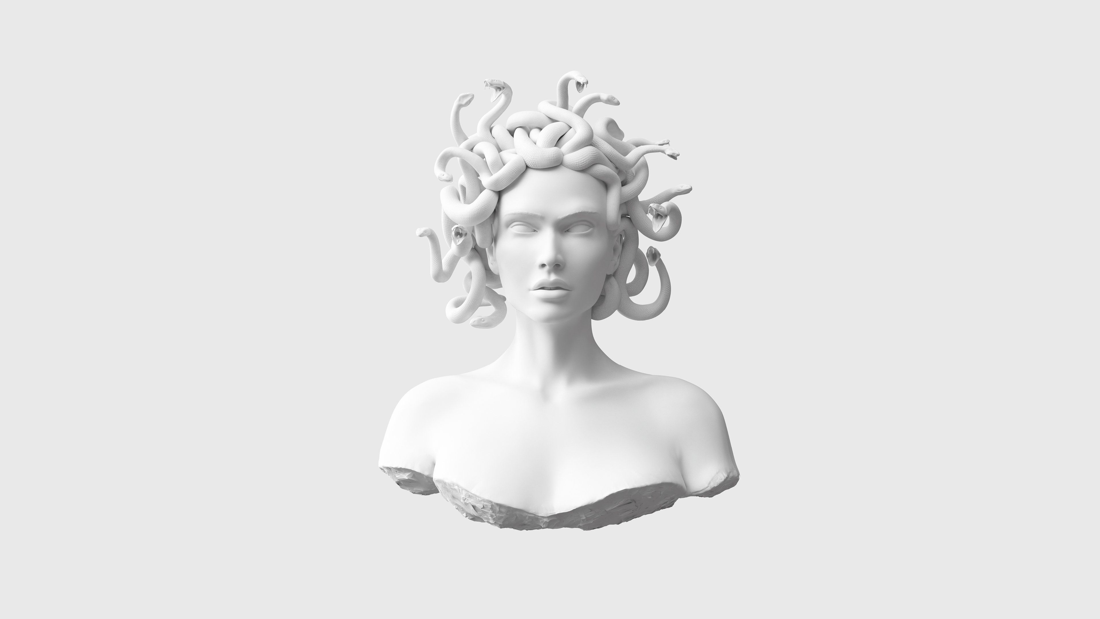 A white sculpture of an ancient woman - Medusa