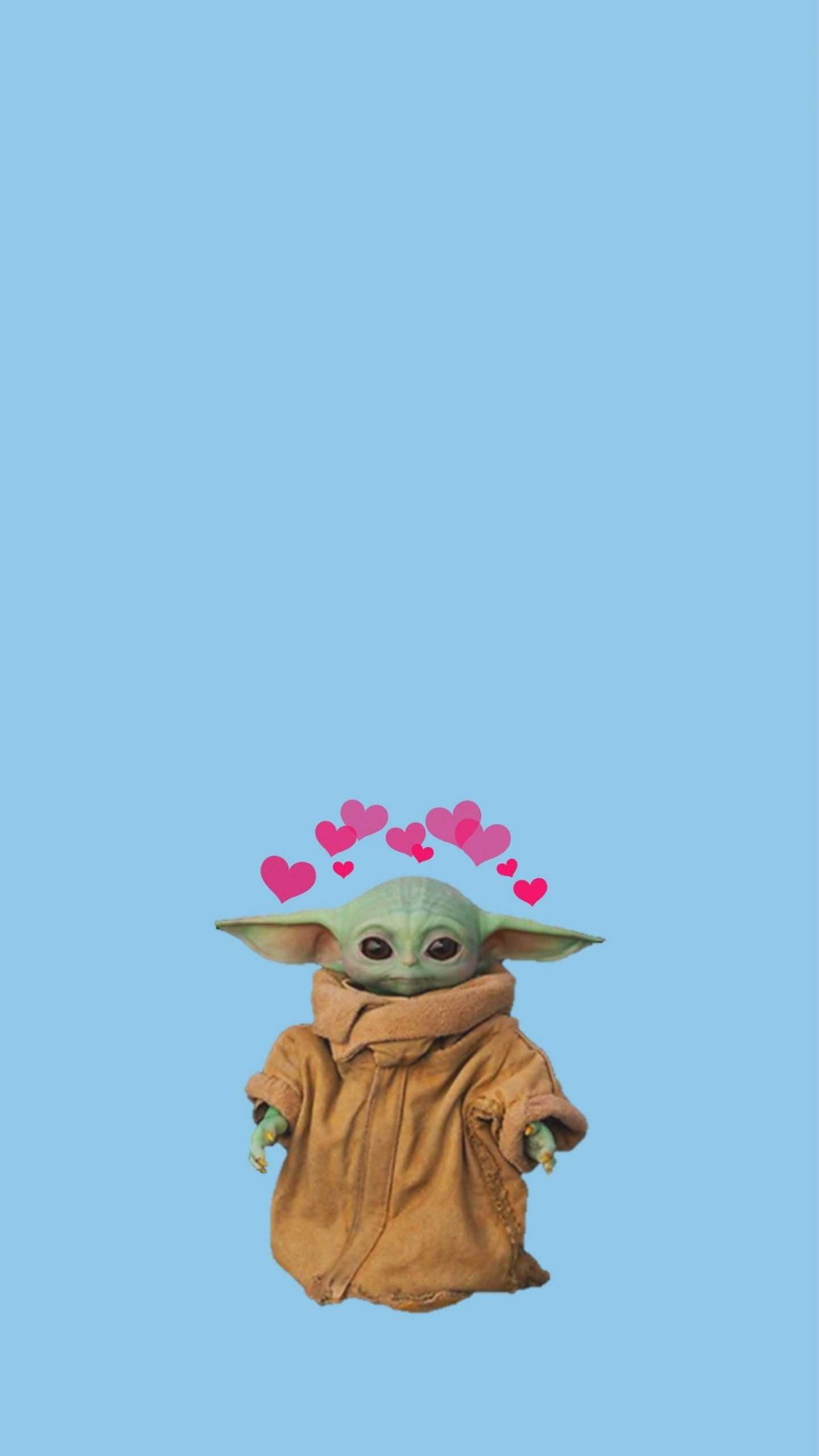 The baby yoda is wearing a brown coat and has hearts around it - Baby Yoda