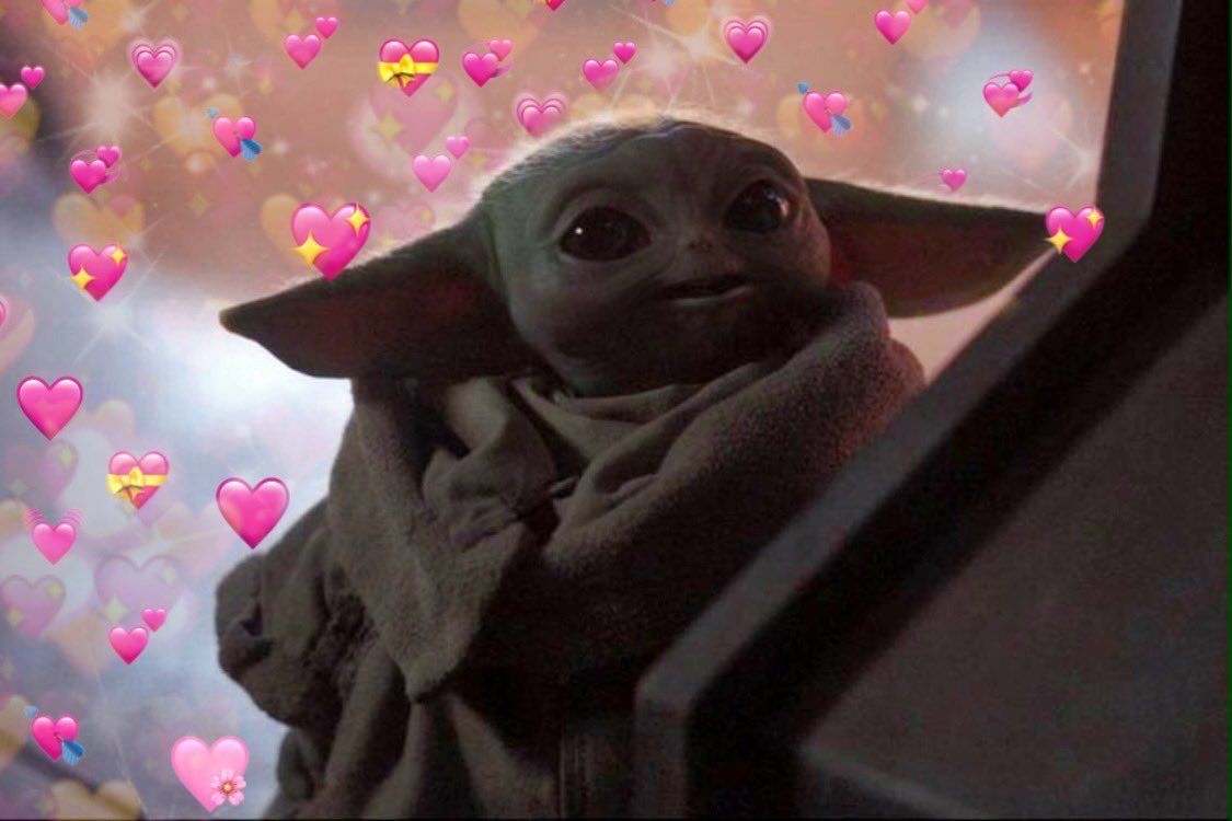 The child in a star wars costume with hearts around it - Baby Yoda