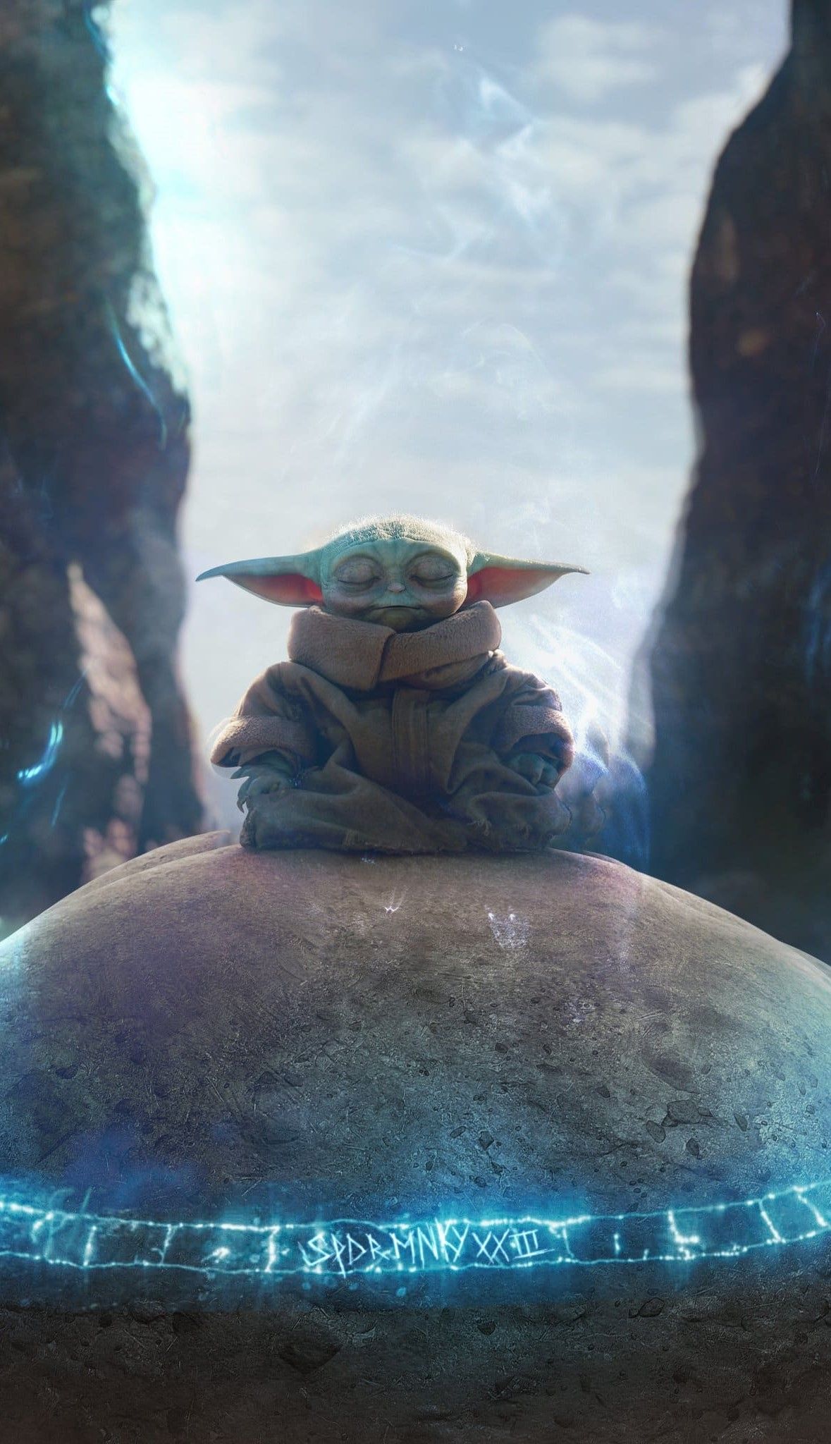 The baby yoda is sitting on a rock - Baby Yoda