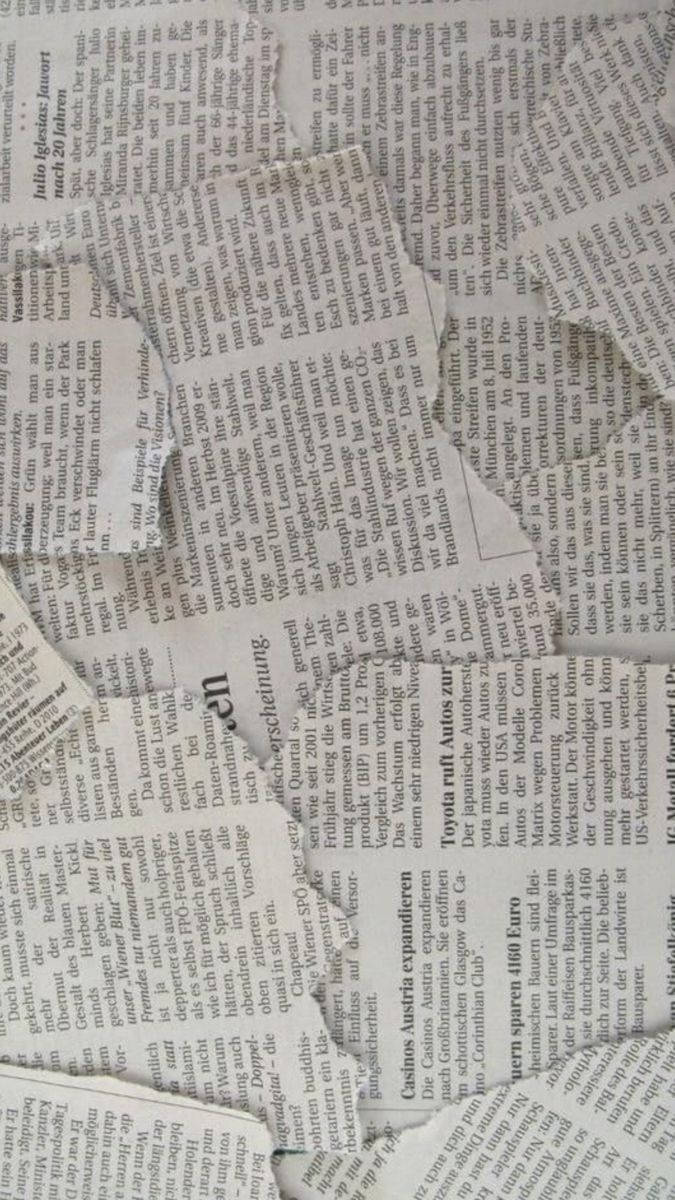 A close up of an old newspaper - Paper