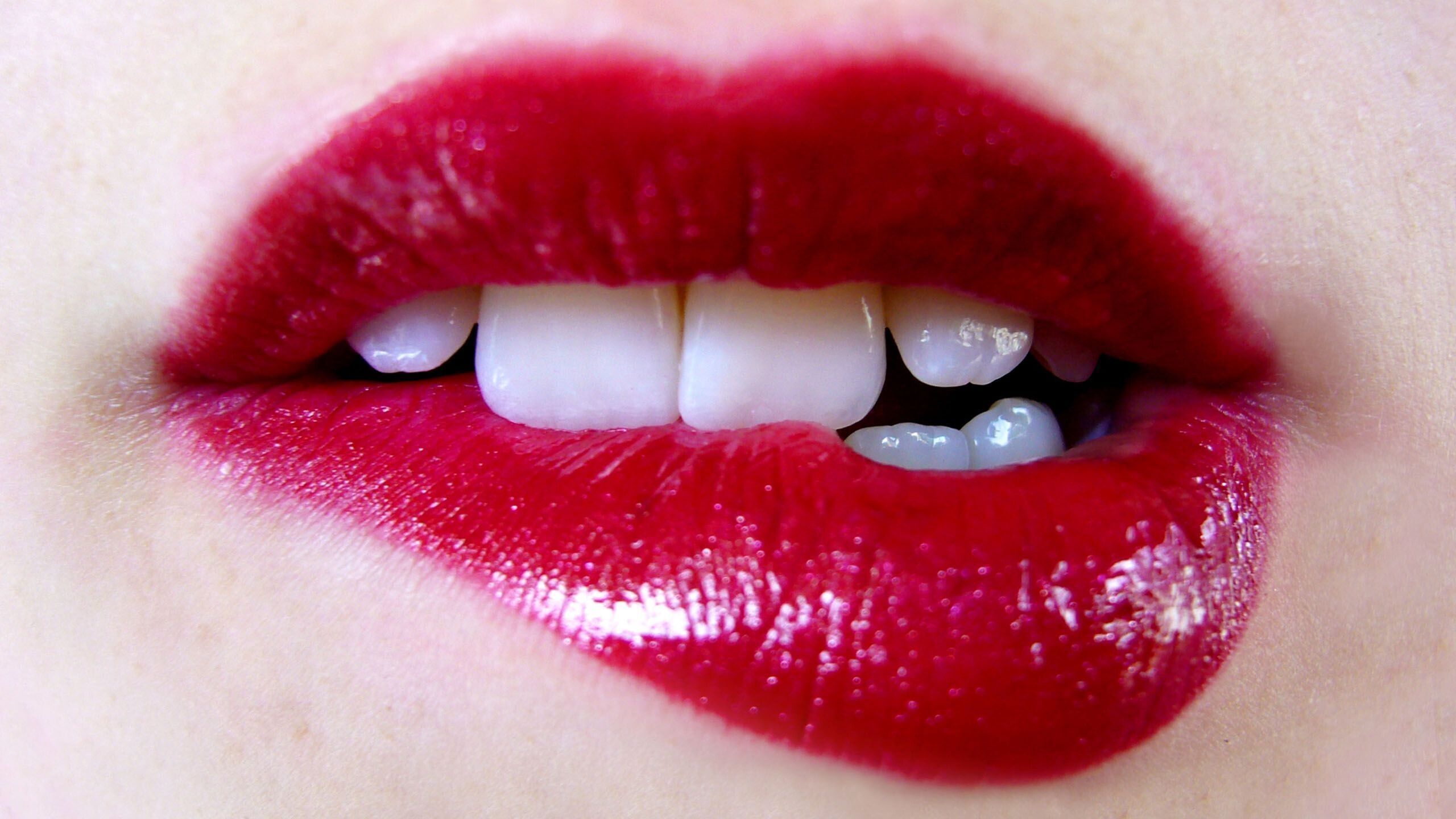 A woman's mouth with red lipstick on - Lips