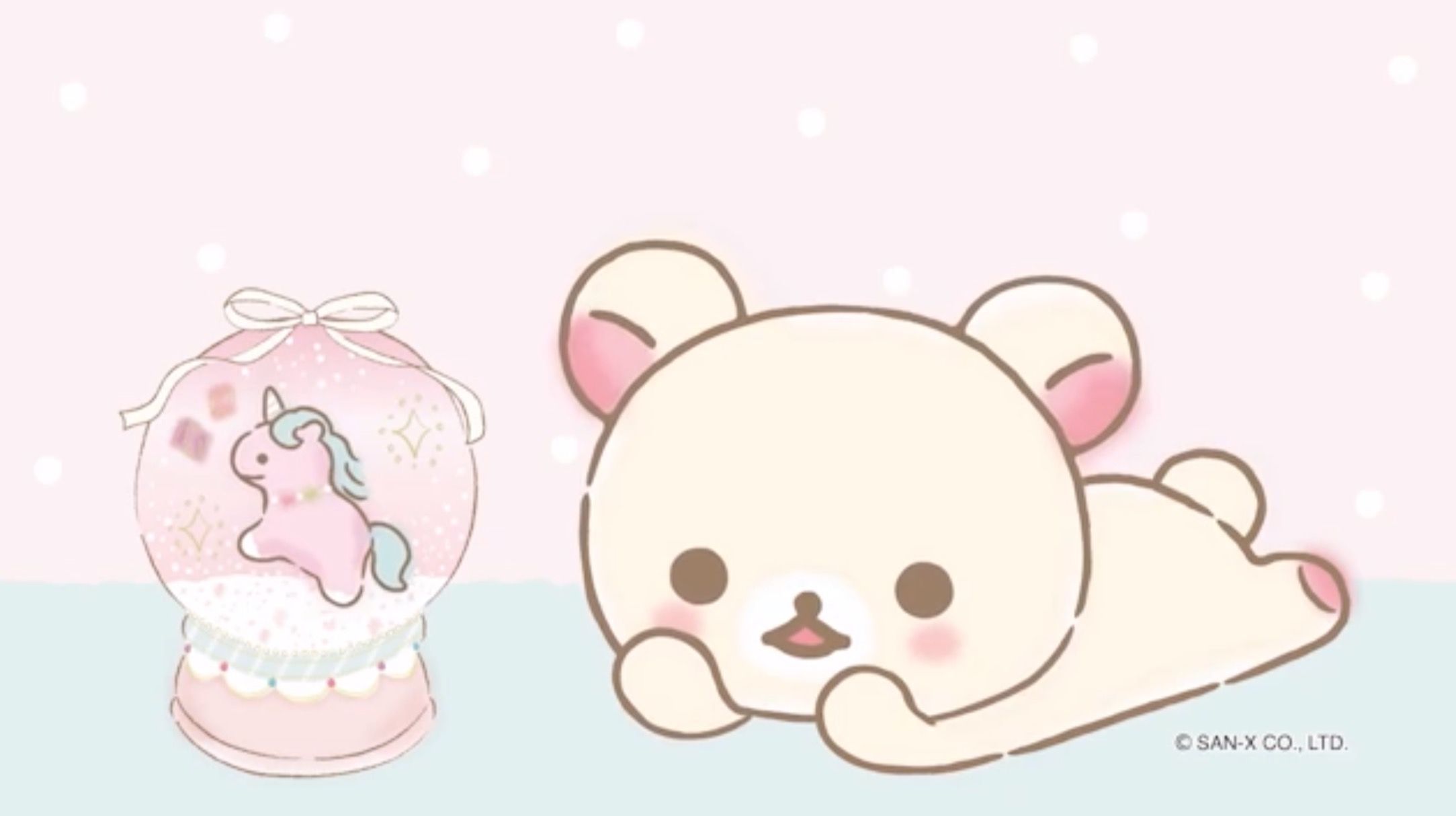 A white kawaii bear with pink cheeks and pink paws and ears is lying on its stomach with its head on its arms. To the left of the bear is a pink glass ball with a blue unicorn inside. - 