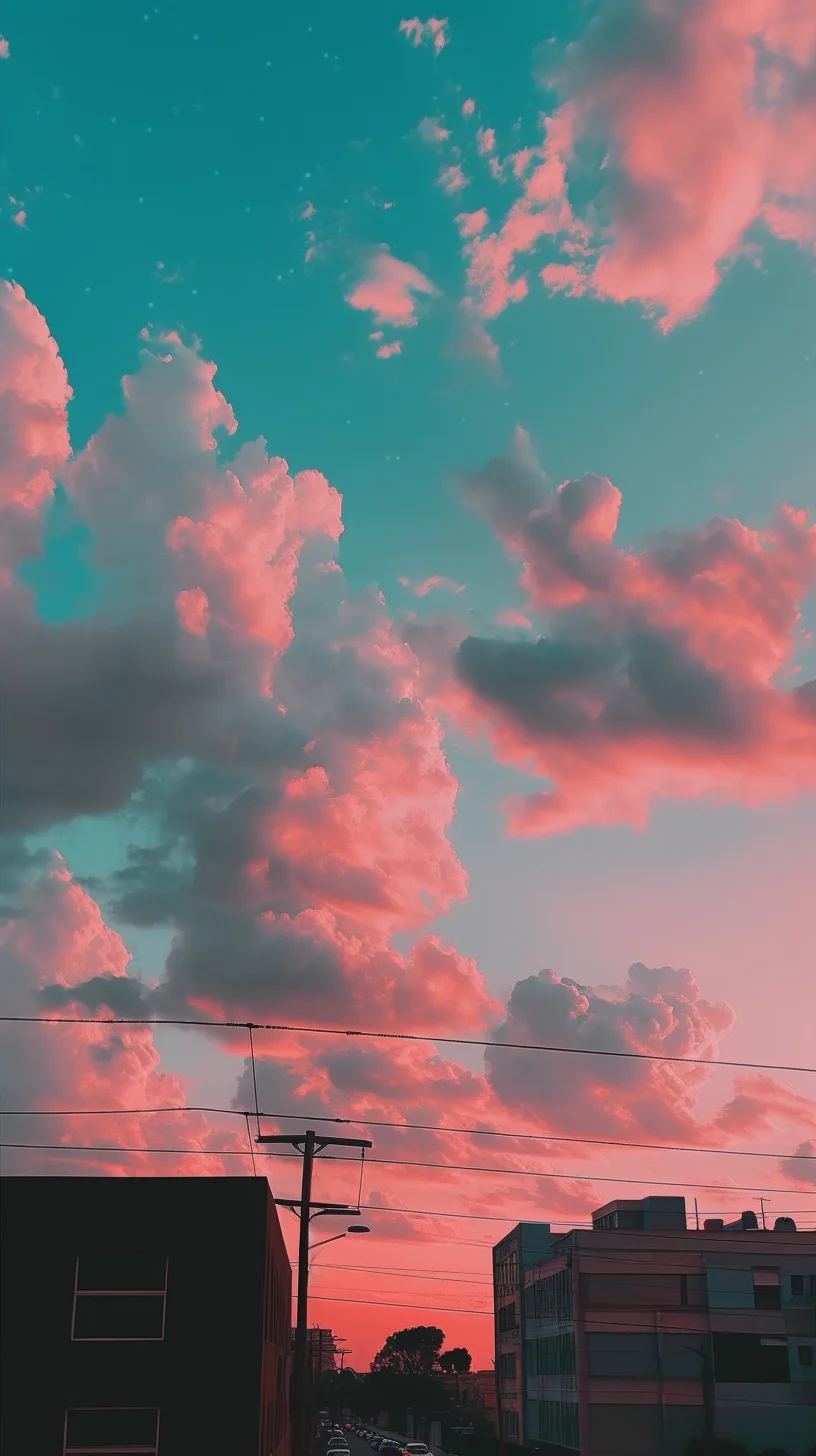 A beautiful sunset with pink and blue clouds over a city - Sunrise, beautiful