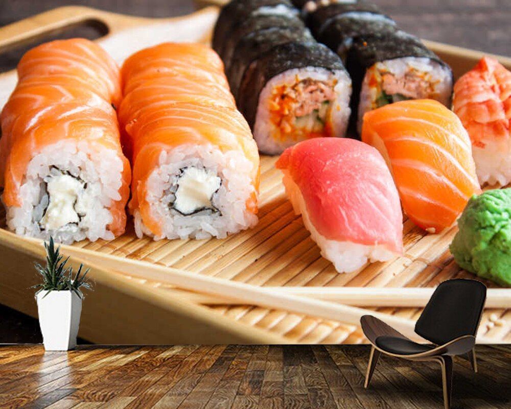 A plate of sushi on a wooden table - Sushi